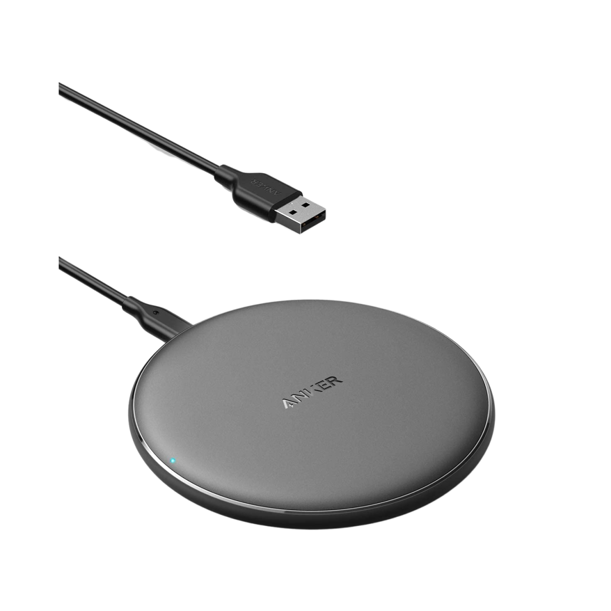 A round, black Anker 313 Wireless Charger (Pad) with a matte finish is displayed on a white background, featuring a black USB cable and USB-A connector above the pad.