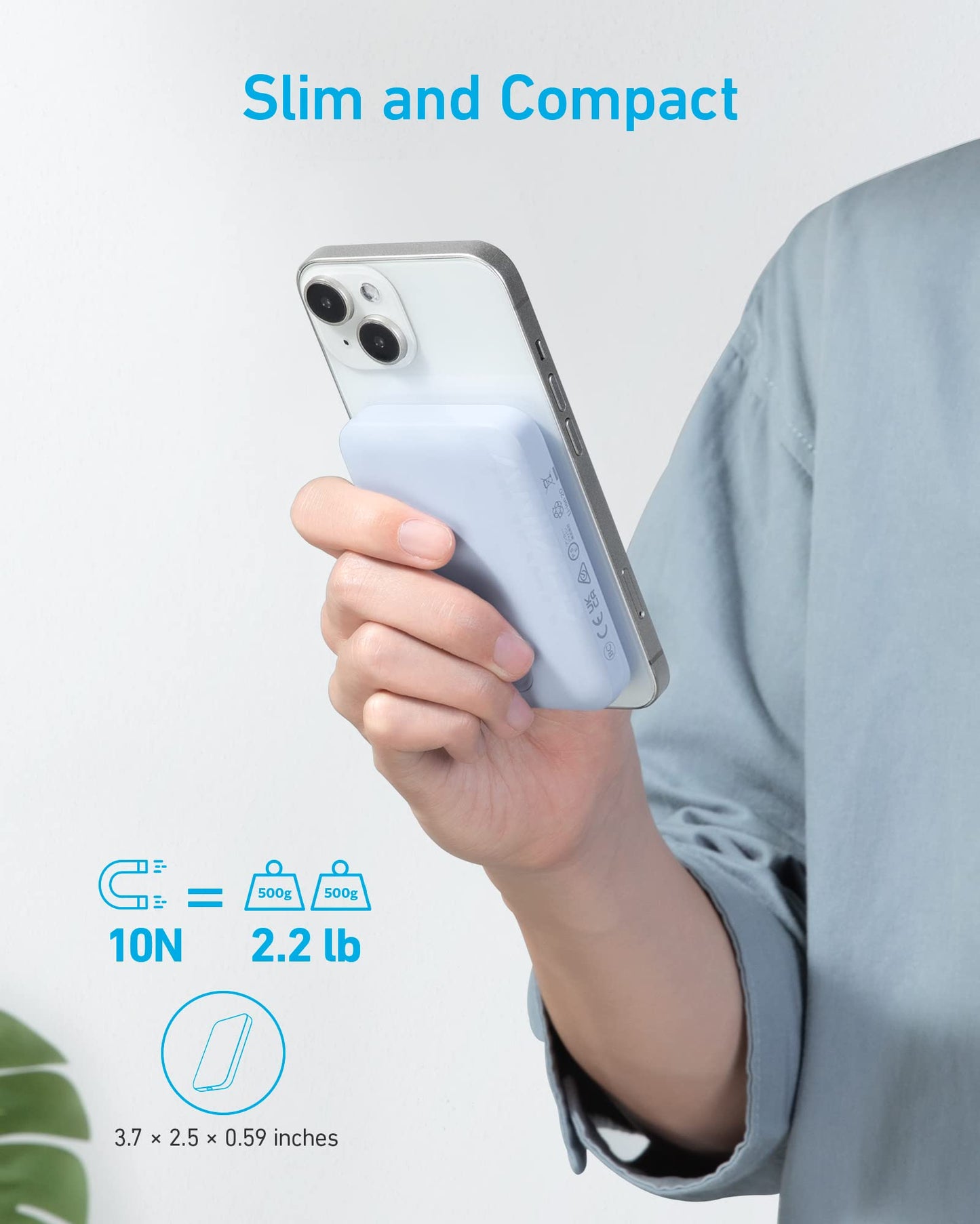 A person holds a smartphone with a slim, light blue Anker 321 MagGo Battery (PowerCore Magnetic 5K) by Anker attached. Blue text reads "Slim and Compact." Graphics highlight its size (3.7 × 2.5 × 0.59 in) and strong 10N (2.2 lb/500g) magnetic hold.