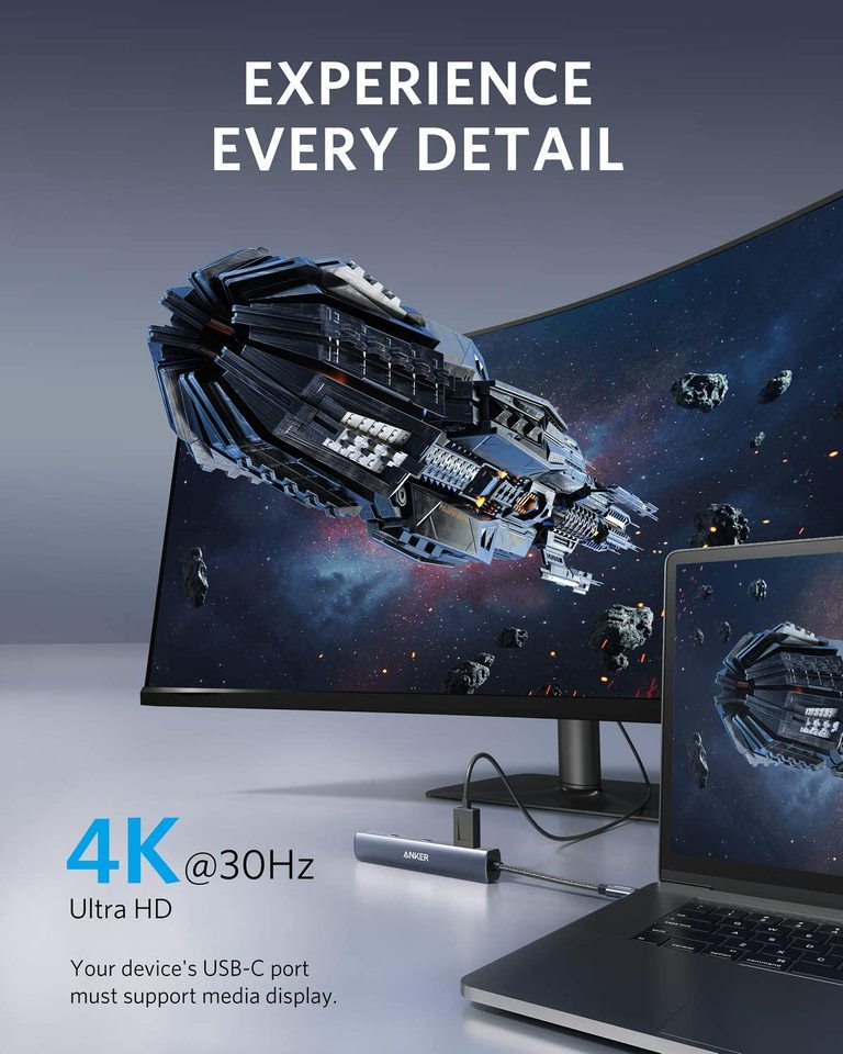 A laptop connects to a curved monitor via the Anker 543 USB-C Hub (6-in-1, Slim), clearly displaying a spaceship scene. Text says "EXPERIENCE EVERY DETAIL" and "4K @ 30Hz Ultra HD," emphasizing seamless power delivery between devices.