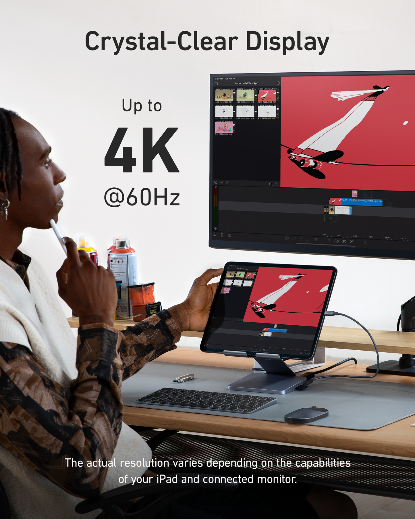 A person uses an iPad on the Anker 551 USB-C Hub (8-in-1, Tablet Stand), connected via HDMI to a large monitor. Both screens show a stylized red and white airplane graphic with the text “Crystal-Clear Display, Up to 4K @60Hz.”.
