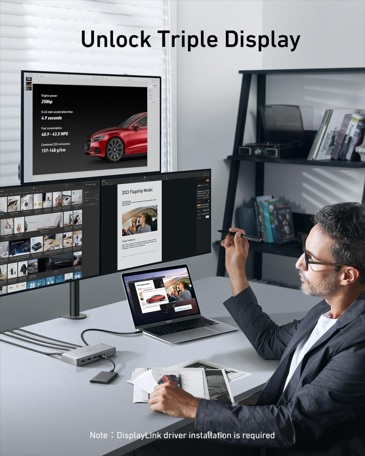 A man in glasses uses a stylus and laptop connected to three monitors via the Anker 563 USB-C Docking Station (10-in-1), which displays car info, photos, and documents. Text above reads “Unlock Triple Display.” Desk accessories and 100W power delivery appear.