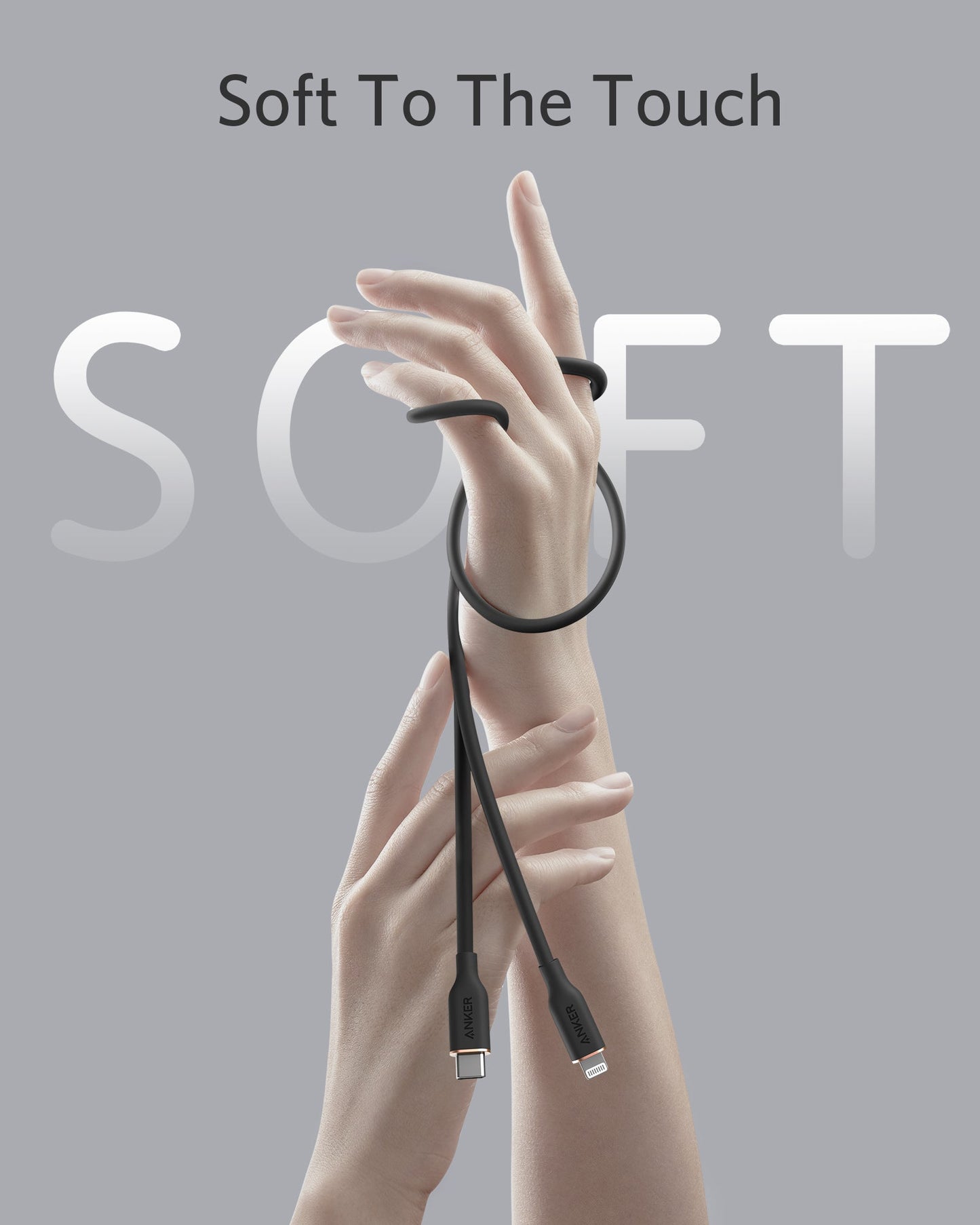 Two hands pose against a light gray background, softly coiled by the Anker 641 USB-C to Lightning Cable (Flow, 3 ft Silicone). Large semi-transparent letters spell SOFT, with the phrase "Soft To The Touch" above. Brand: Anker.