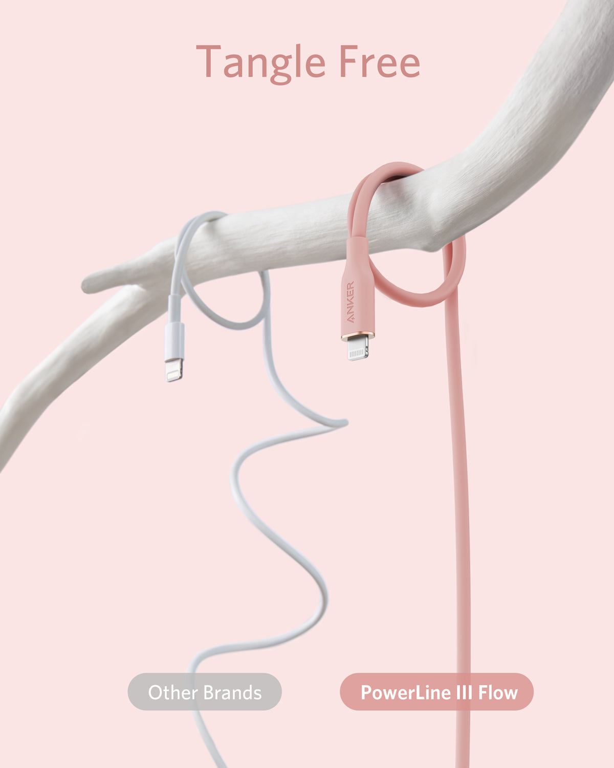 A tangled white USB-C to Lightning cable from another brand hangs from a white branch, while the pink, neatly looped Anker 641 USB-C to Lightning Cable (Flow, 3 ft Silicone) remains tangle-free. Above, text on pink reads "Tangle Free.