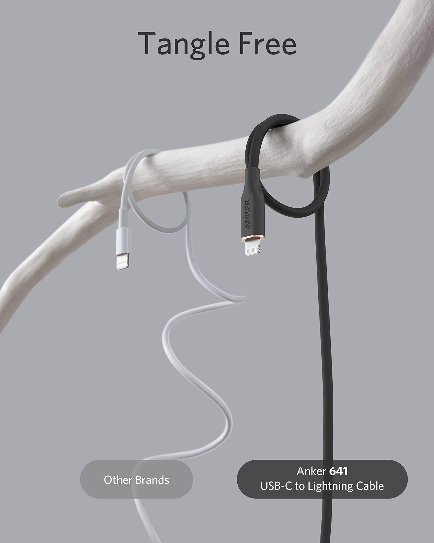 Two charging cables hang from a branch. The left, labeled Other Brands, is a tangled light gray cable. The right, labeled Anker 641 USB-C to Lightning Cable (Flow, Silicone), hangs neatly in a loop, showing its tangle-free design.