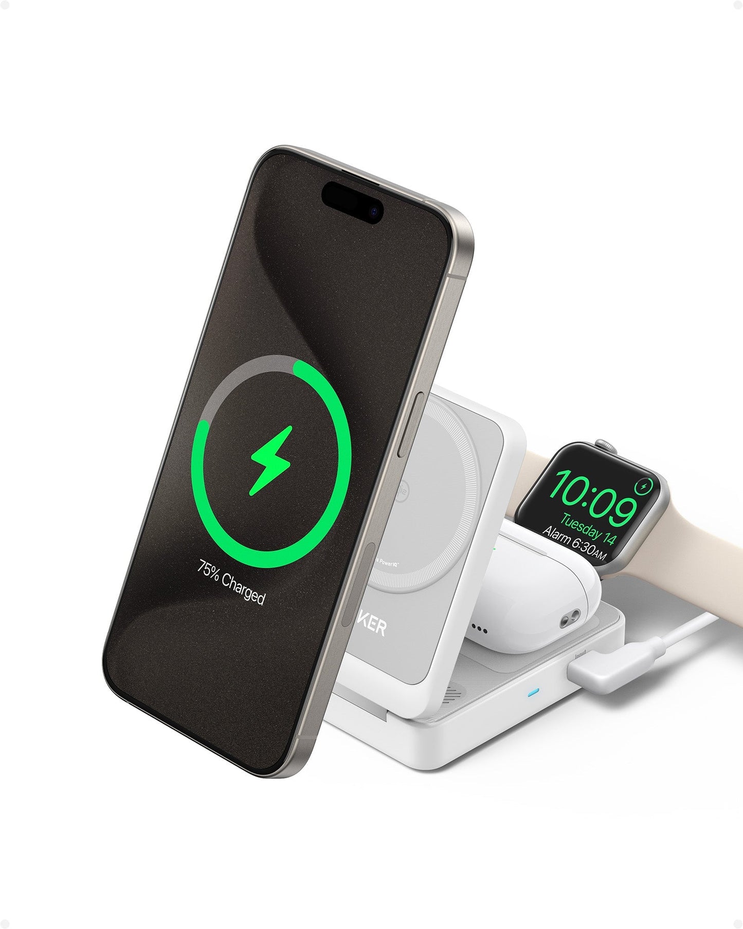 An Anker MagGo Wireless Charging Station (Foldable 3-in-1) wirelessly charges a smartphone showing “75% Charged,” wireless earbuds, and a beige smartwatch displaying 10:09, Tuesday, April 9.