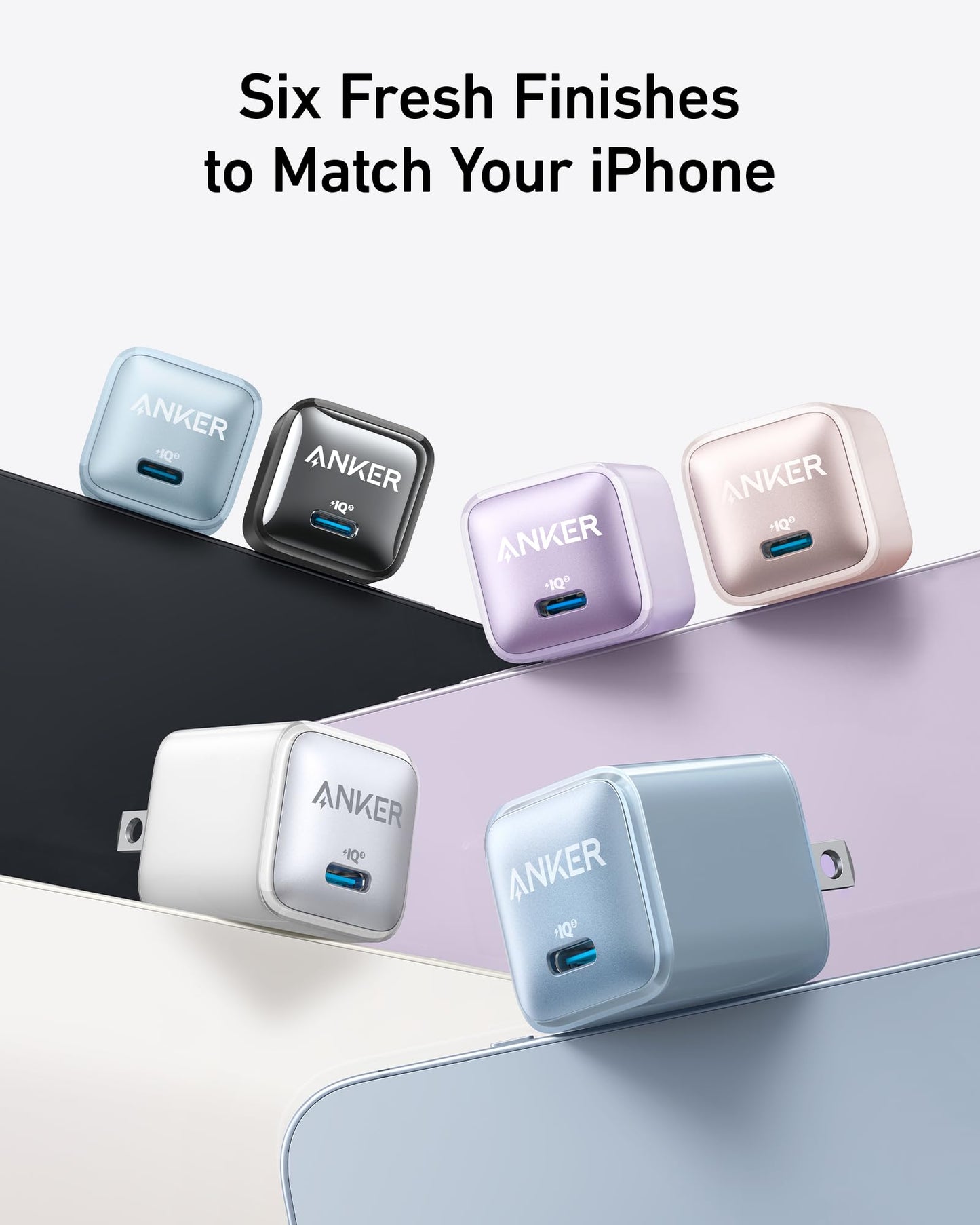 Six Anker Nano Charger (20W) cubes by Anker in black, dark blue, light blue, pink, white, and purple hover above matching iPhones. Text above says: “Six Fresh Finishes to Match Your iPhone.” Each USB-C charger delivers high-speed charging.