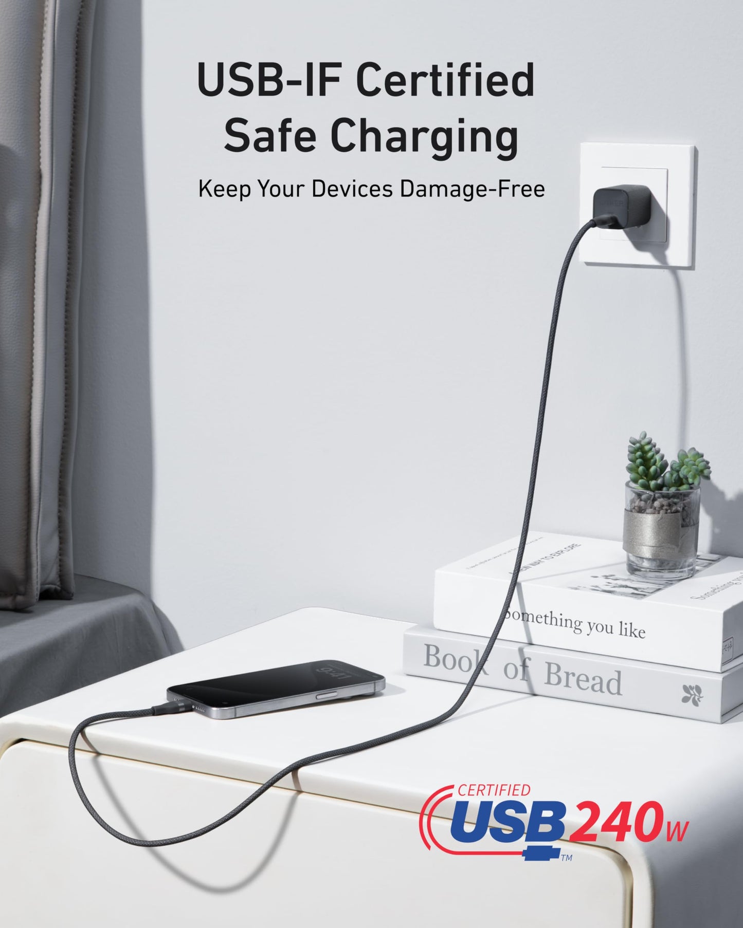 An Anker USB-C to USB-C Cable (3 ft / 6 ft, 240W, Upcycled-Braided) charges a smartphone on a white nightstand, with “USB-IF Certified Safe Charging – Keep Your Devices Damage-Free” text above and a “Certified USB 240W” logo below.