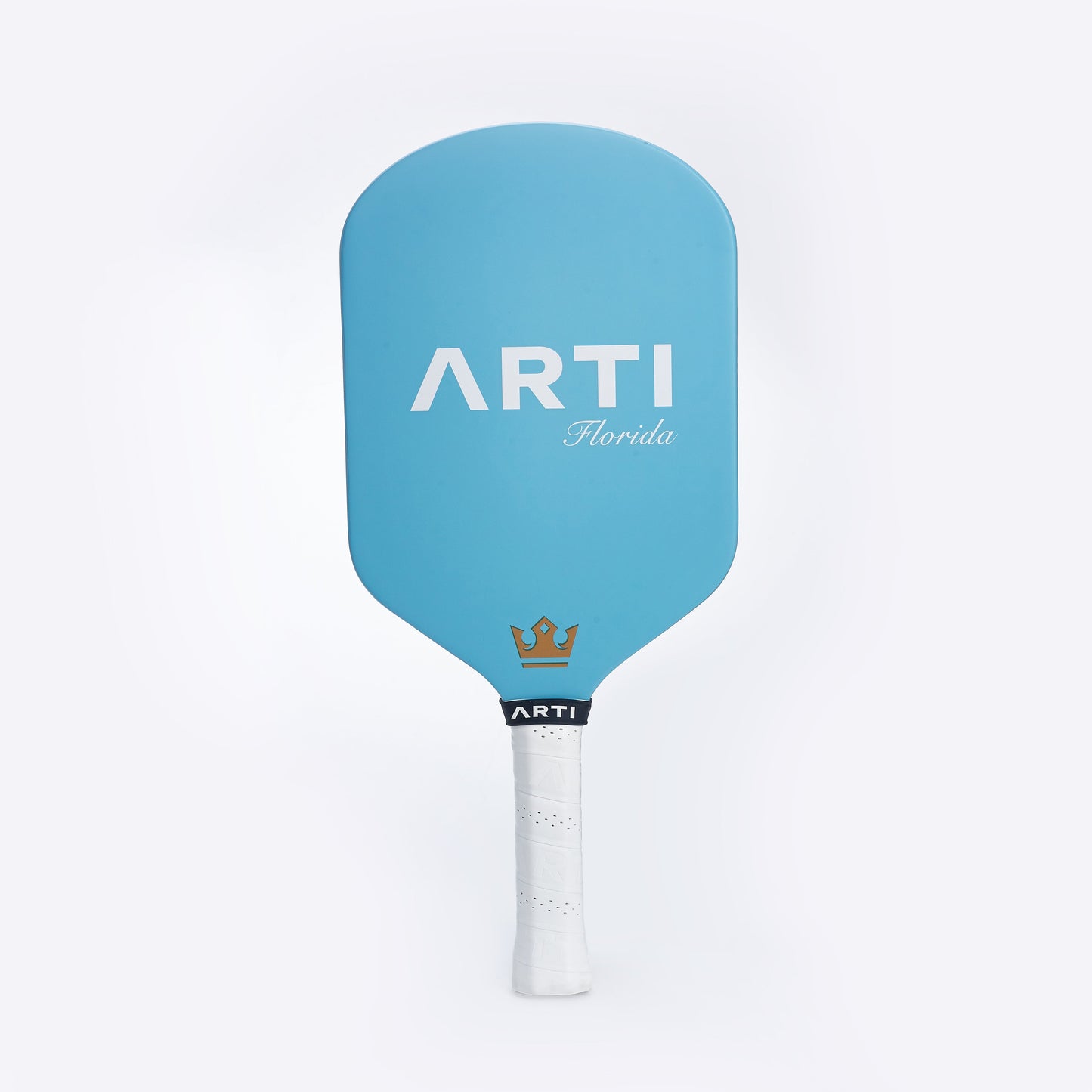 The ARTI Carbon Fiber "FLORIDA" paddle features a light blue design, large white ARTI branding, "Florida" in cursive, and a gold crown logo above a textured white handle. This USAPA-approved T700 paddle is set against a plain white background.