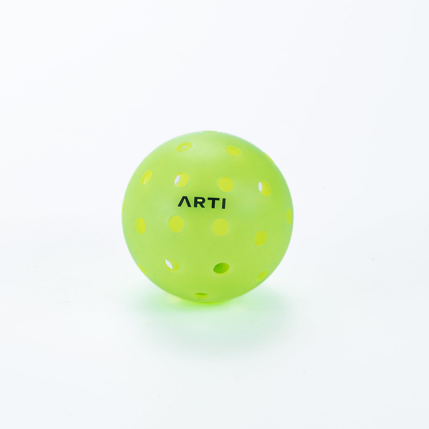 The ARTI Outdoor Pickleball, a bright green, high-visibility ball with evenly spaced holes and “ARTI” printed in black uppercase letters, is shown against a plain white background.