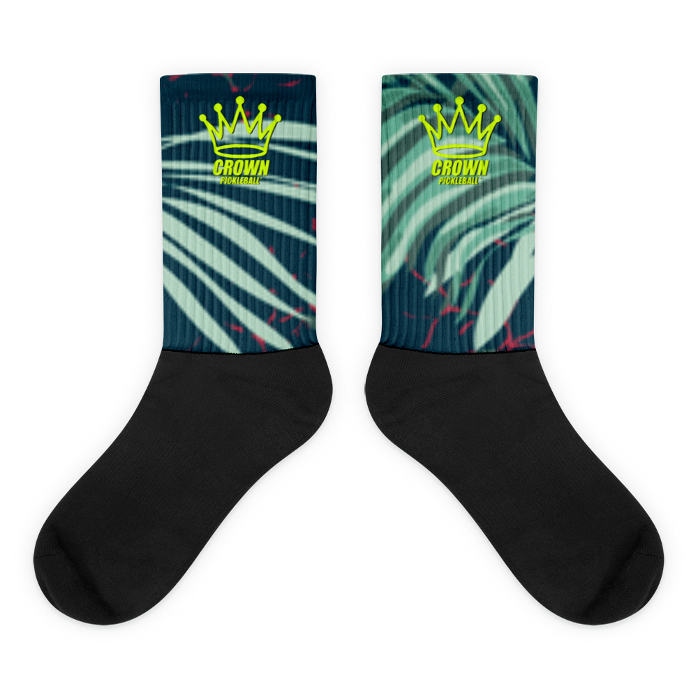 Crown Pickleball - Performance Athletic Crew Socks feature cushioned soles, solid black feet and cuffs, a green/teal palm leaf pattern, and a yellow crown graphic with "CROWN PICKLEBALL" on the upper part.
