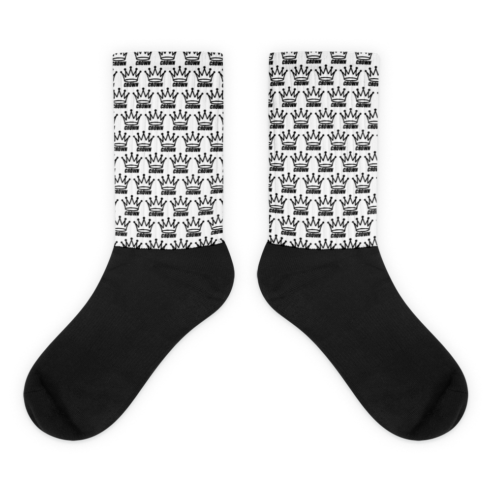 Step up your game with Crown Pickleball’s Checkered Crown (White) socks. Featuring black feet, white shafts with a repeating black crown design, and cushioned soles for comfort, these crew-length socks offer a bold yet simple monochrome style.