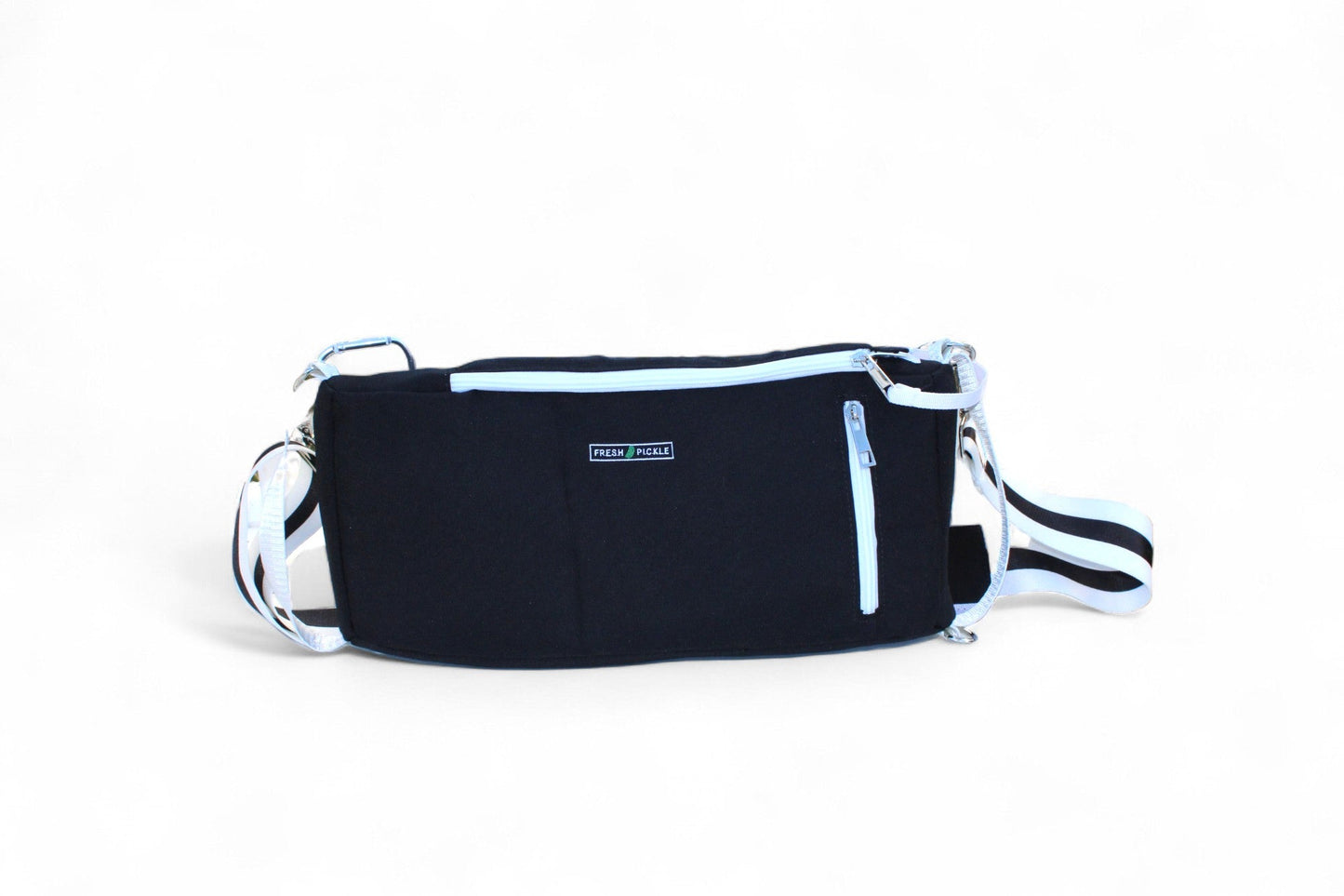 A rectangular black Insulated Cooler Bag by Fresh Pickle with a white zipper and trim, adjustable white strap with black stripes, and front label. Ideal for court essentials, shown against a plain white background.