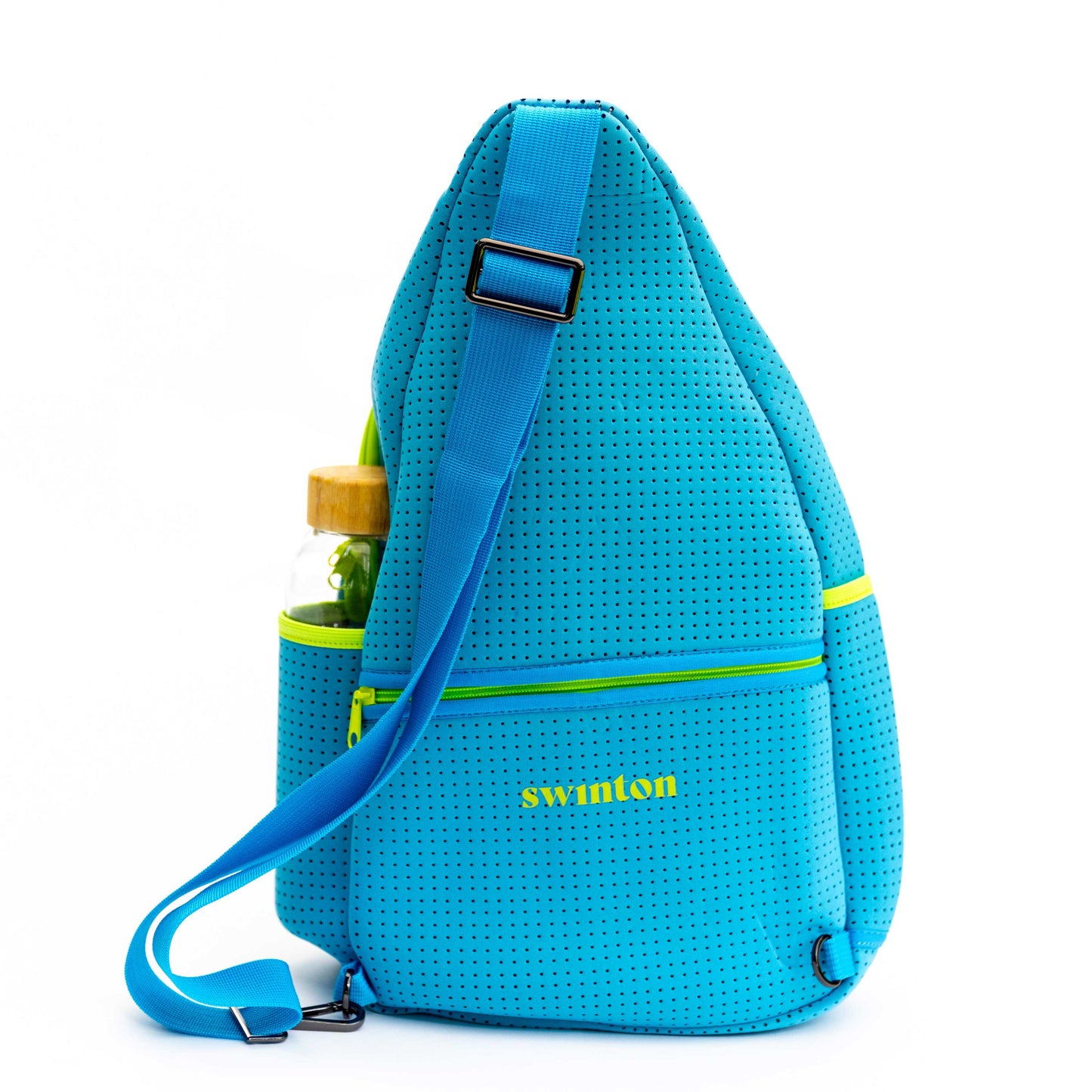The Swinton Pickleball Sling Bag - Blue features a wide adjustable strap, front zip pocket with yellow Swinton logo, and a side bottle pocket with a green cap and wooden top, all set against a white background.