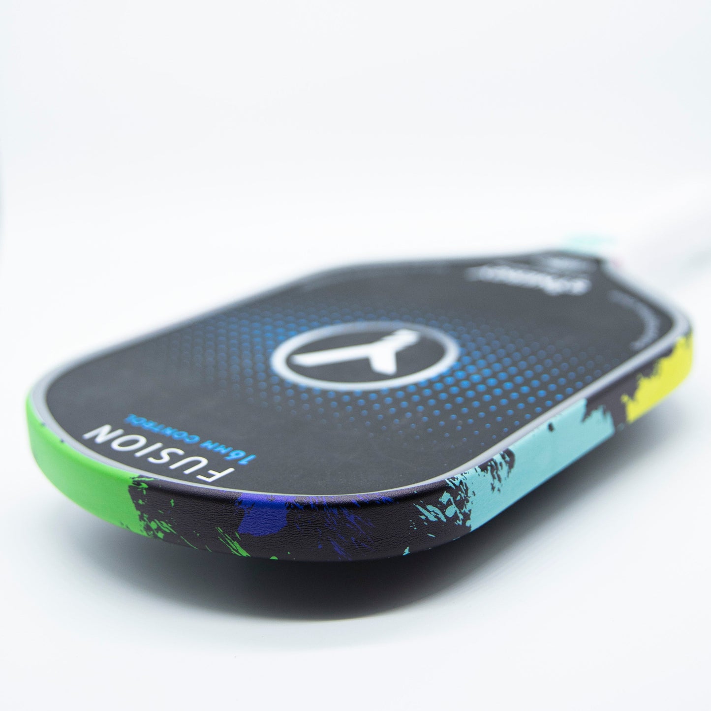 A close-up of a black pickleball paddle with Bodhi Performance's Premium Edge Tape for professional edge guard protection, featuring a colorful splatter design in green, yellow, and blue. Paddle shows circular logo and text: FUSION 16MM CONTROL.