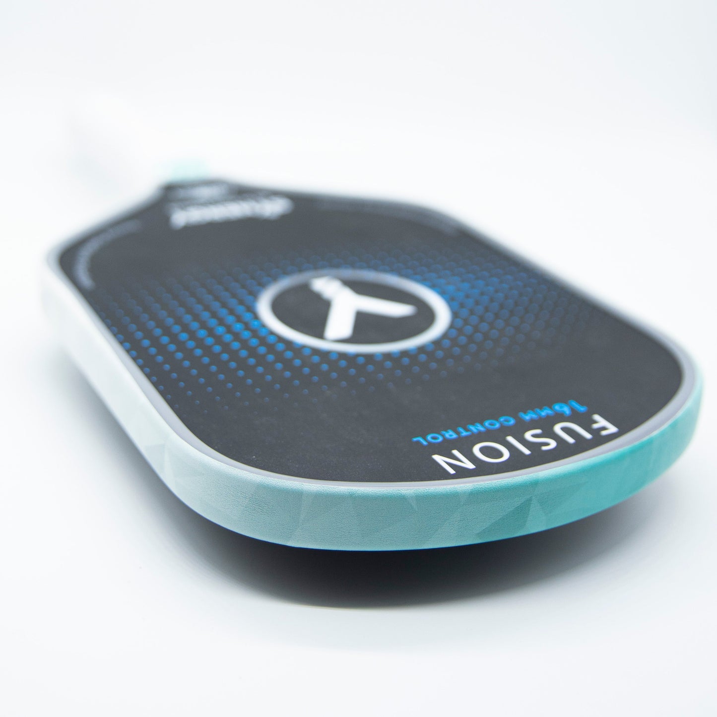 Close-up of a black pickleball paddle with blue accents and "FUSION 15 MM CONTROL" on the edge, featuring Bodhi Performance - Premium Edge Tape for professional edge guard protection. The handle fades into the background.