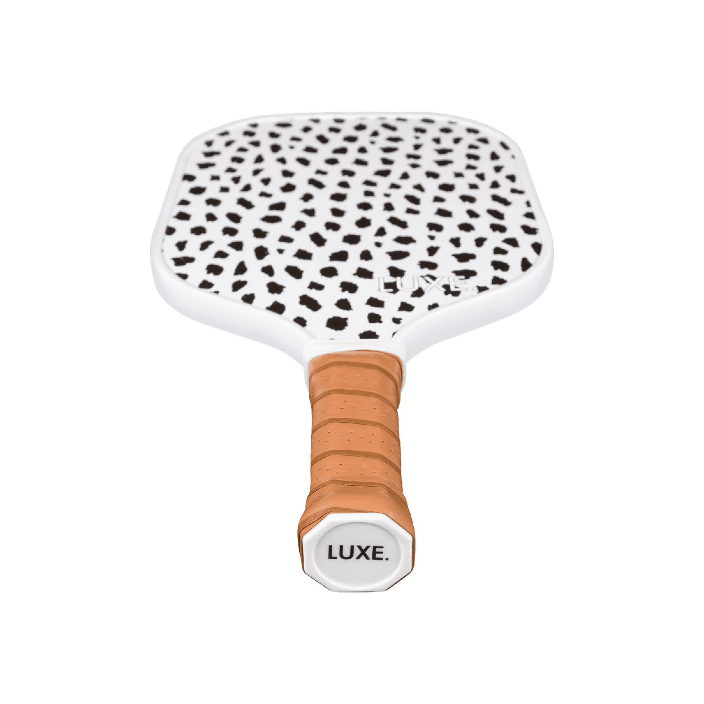 The Cheetah paddle by LUXE Pickleball features a white face with black cheetah spots, a tan leather-like grip for comfort, and an end cap marked "LUXE." Ideal for players seeking style and speed. Photo background is plain white.