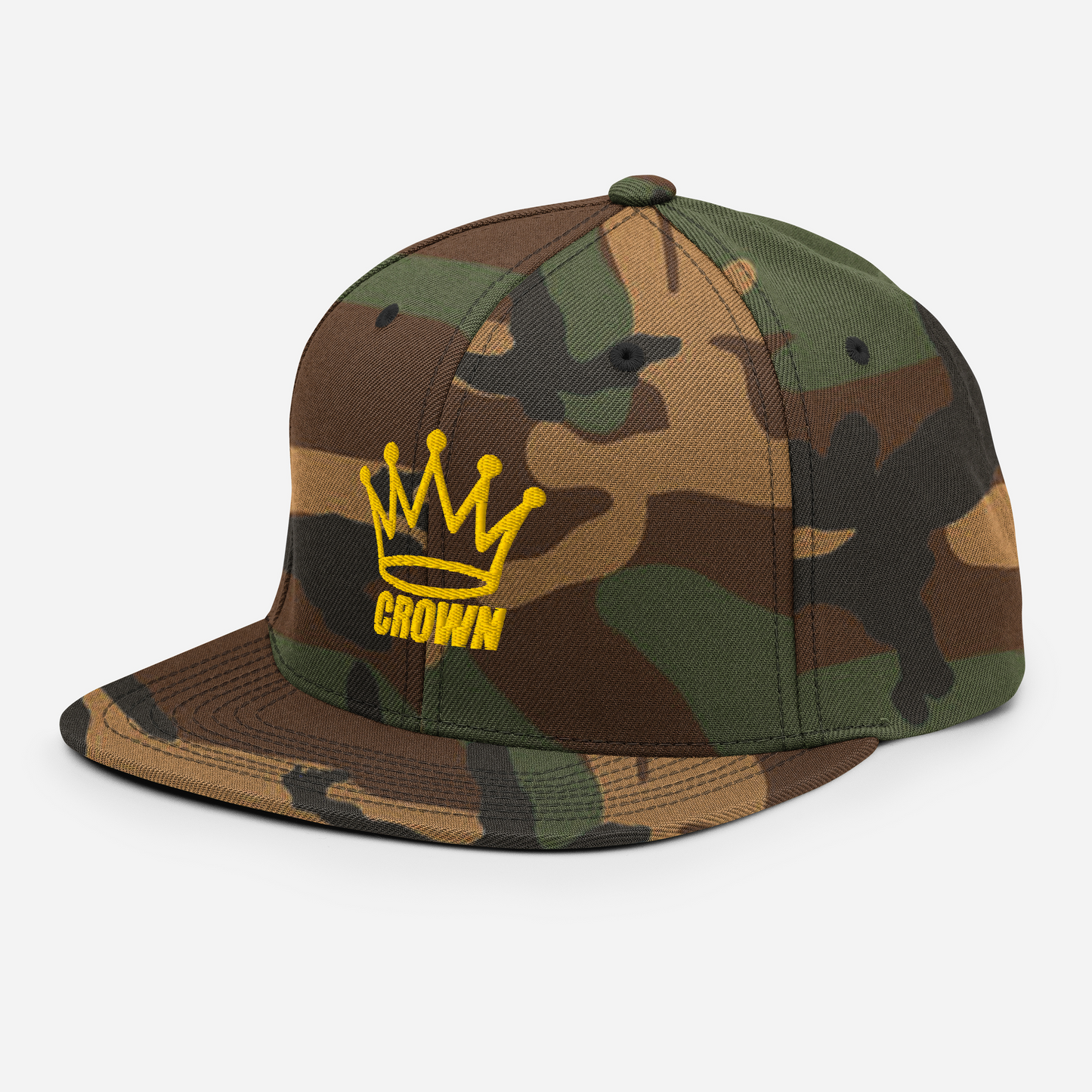 The CROWN PICKLEBALL - Corona Snap-back Hat (Camo) by Crown Pickleball features a flat brim, green and brown camouflage pattern, and a yellow embroidered crown with "CROWN" on the front, shown against a white background.