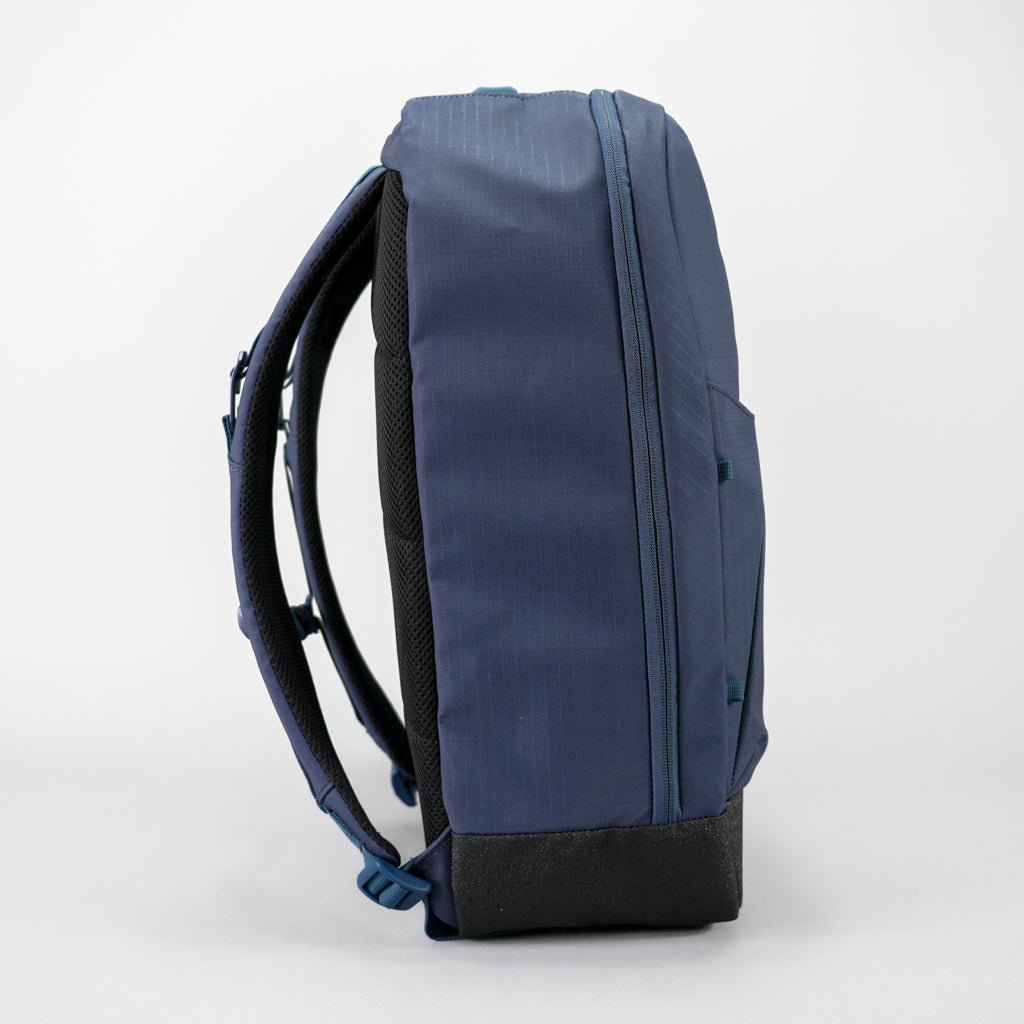 The FORWRD Court Ranger Pickleball Backpack is shown upright in navy blue with padded black panels, adjustable straps, a side pocket, and a sturdy black bottom—a top pickleball bag under $200.