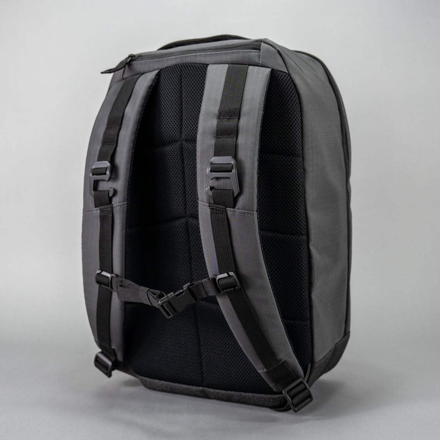The FORWRD Court Ranger Pickleball Backpack stands upright in sleek black, featuring padded shoulder straps, a chest strap clip, and adjustable buckles for comfort—all showcased against a plain light gray background as a top pick under $200.