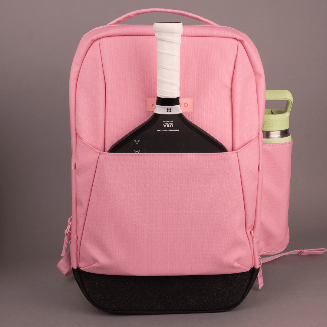 The FORWRD Court Ranger Pickleball Backpack in pink includes a paddle—ideal for players looking for the best pickleball bag under $200.