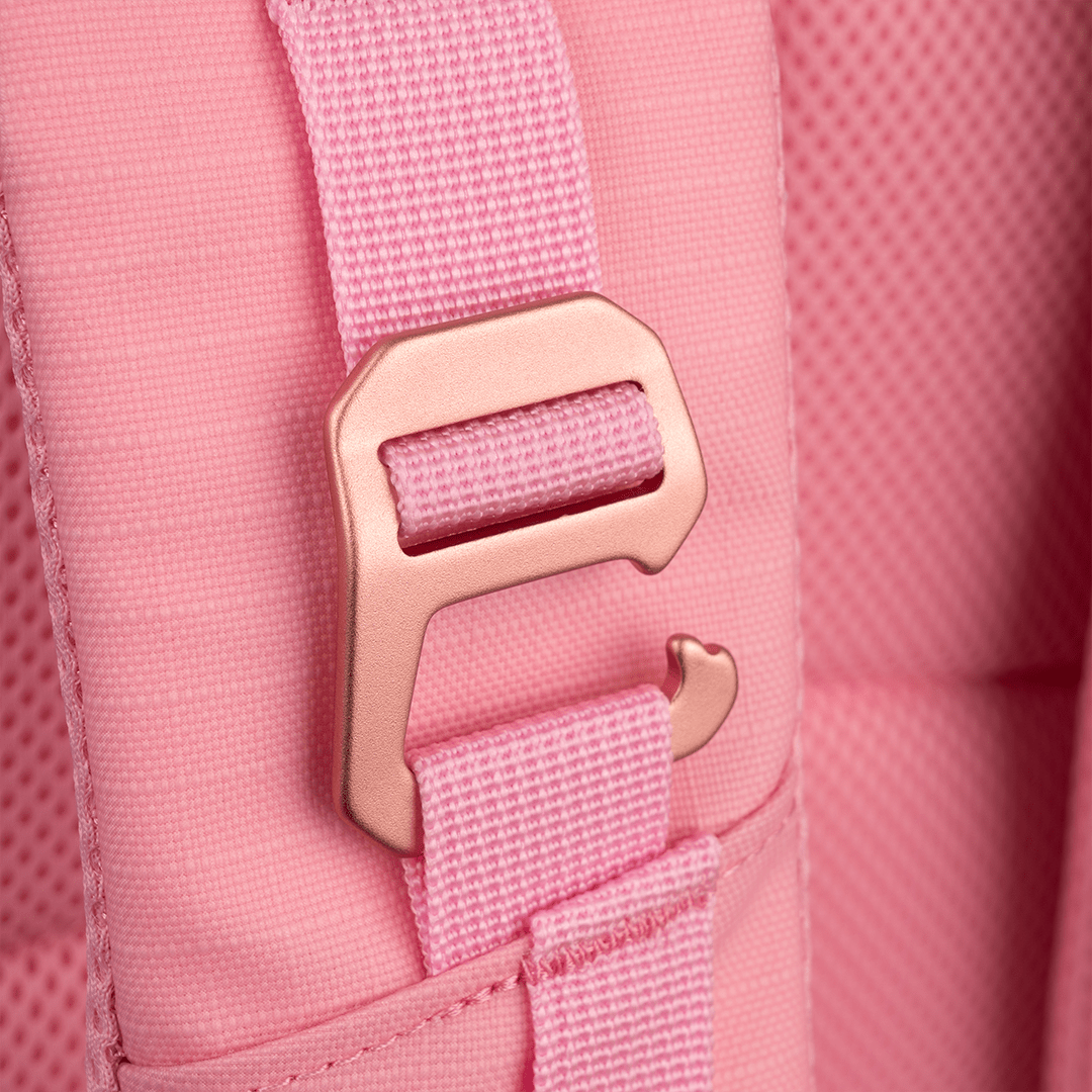 Close-up of the FORWRD Court Ranger Pickleball Backpack's pink strap with a rose gold metallic buckle, showcasing the padded, textured fabric and precise stitching that reflect the backpack’s premium quality and hardware finish.