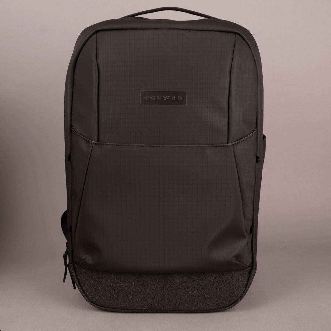 The FORWRD Court Ranger Pickleball Backpack, in sleek black with a minimalist design and a small front logo, stands upright against a plain light background—an ideal pick for those seeking the best pickleball bag.