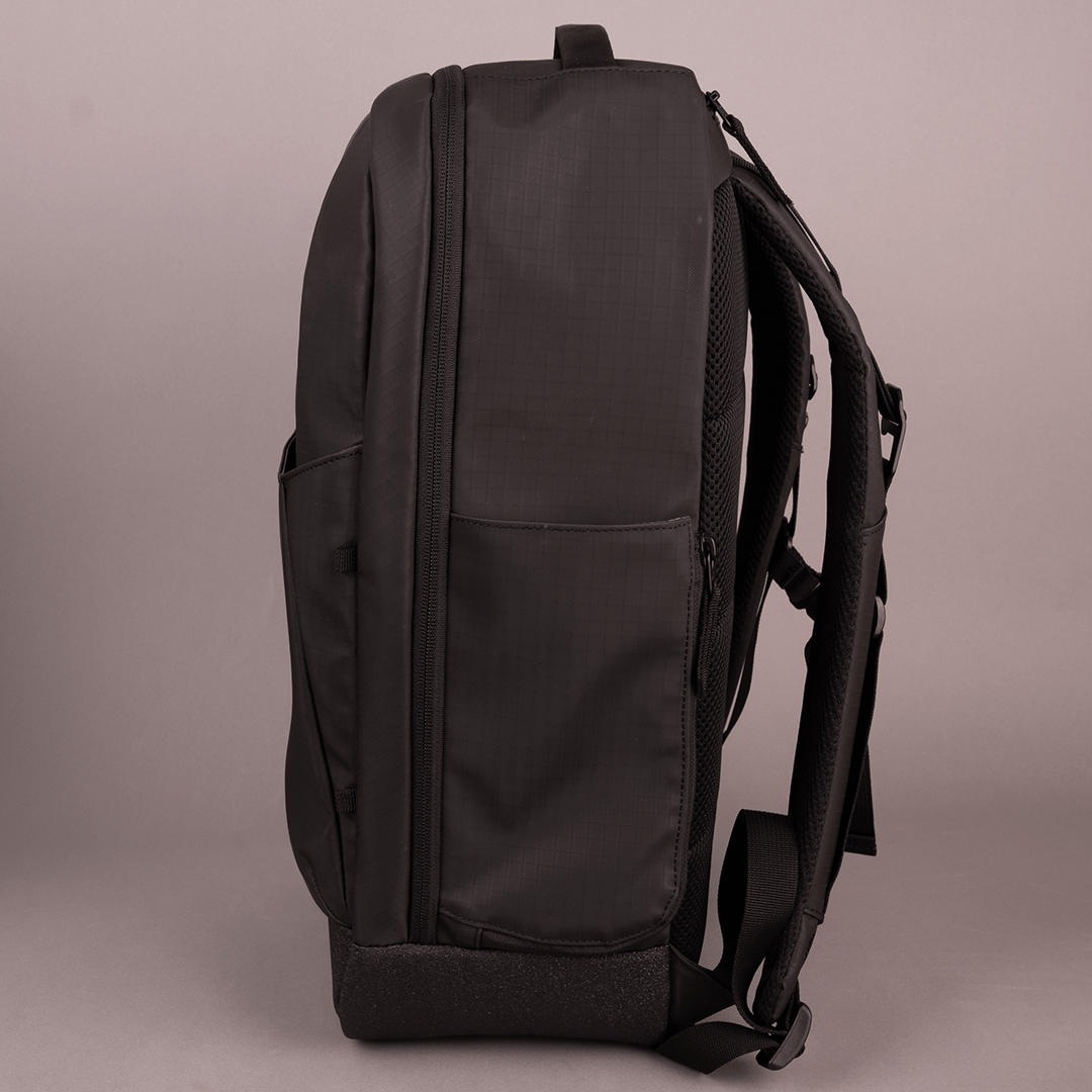 The FORWRD Court Ranger Pickleball Backpack stands upright on a neutral background, shown from the side. It features a front pocket, padded shoulder straps, top handle, and a zipper outlining the main compartment.