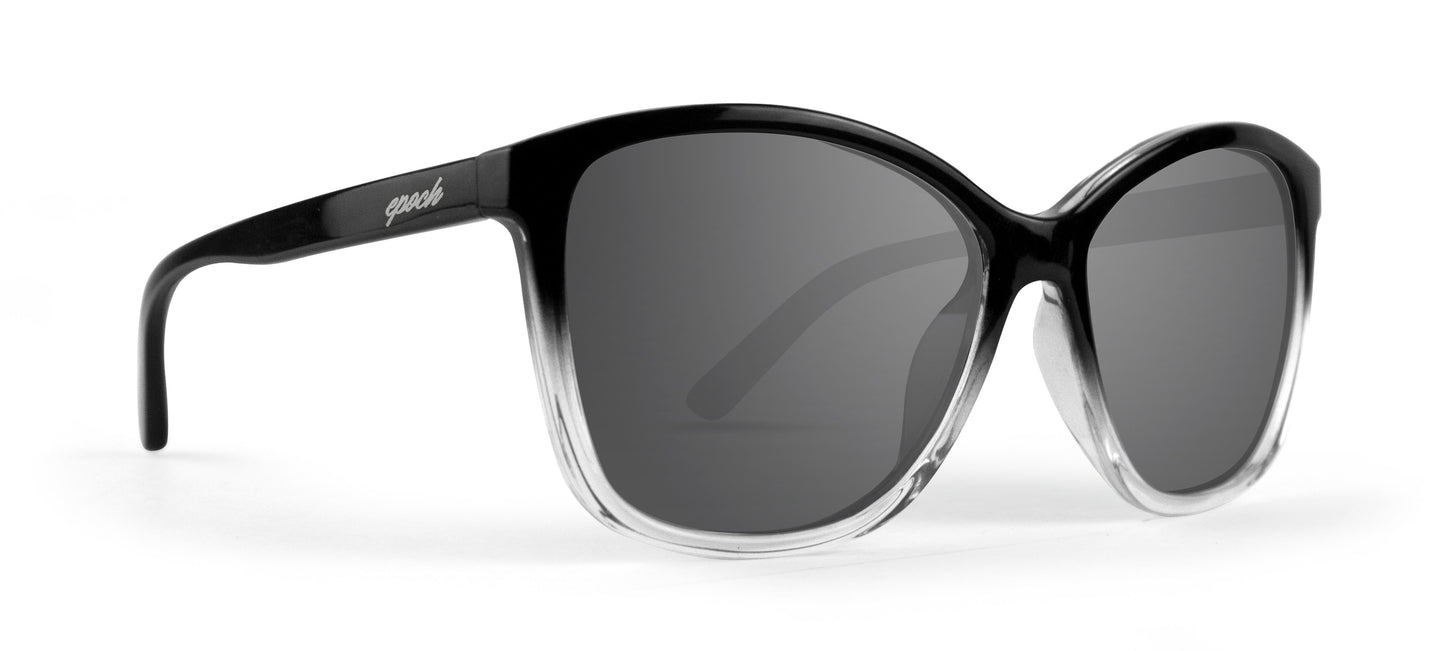Epoch Eyewear’s Elizabeth sunglasses feature large, round lenses with dark polarized tint, a chic black-to-clear thick frame, and glossy black arms with a white logo near the left hinge—perfect for women’s lifestyle wear.