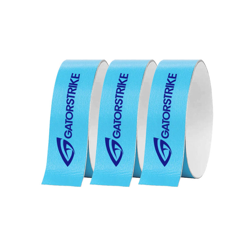 Three upright rolls of GATORSTRIKE™ Edge Guard Tape - 3 Pack, each featuring the bold GATORSTRIKE name and gator logo, stand on a plain white background—perfect for protecting your pickleball paddle edges.