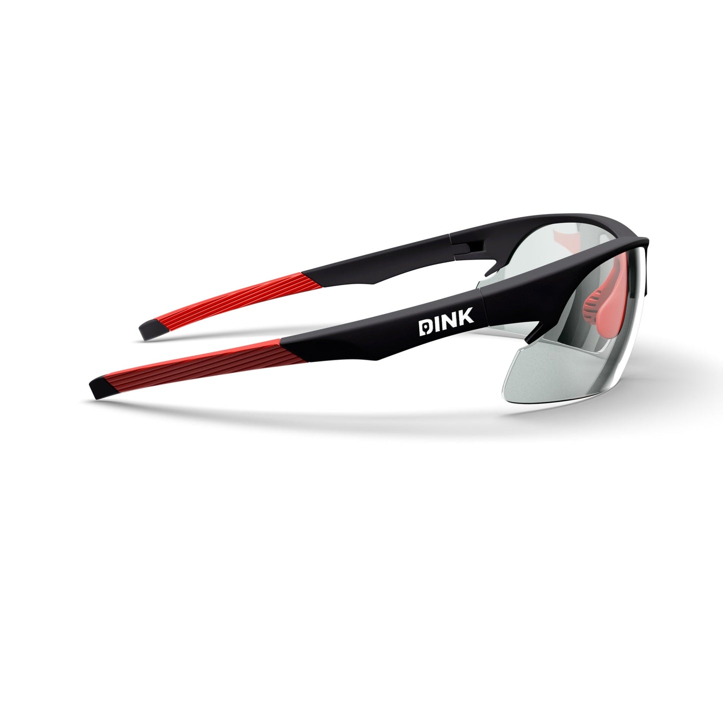 The Daytona Pickleball Sunglasses by Dink Eyewear feature a sporty wrap design with clear lenses, black frames, and red accents. White PINK logo on the temple, plus angled arms and nose pads for comfort—ideal for pickleball.