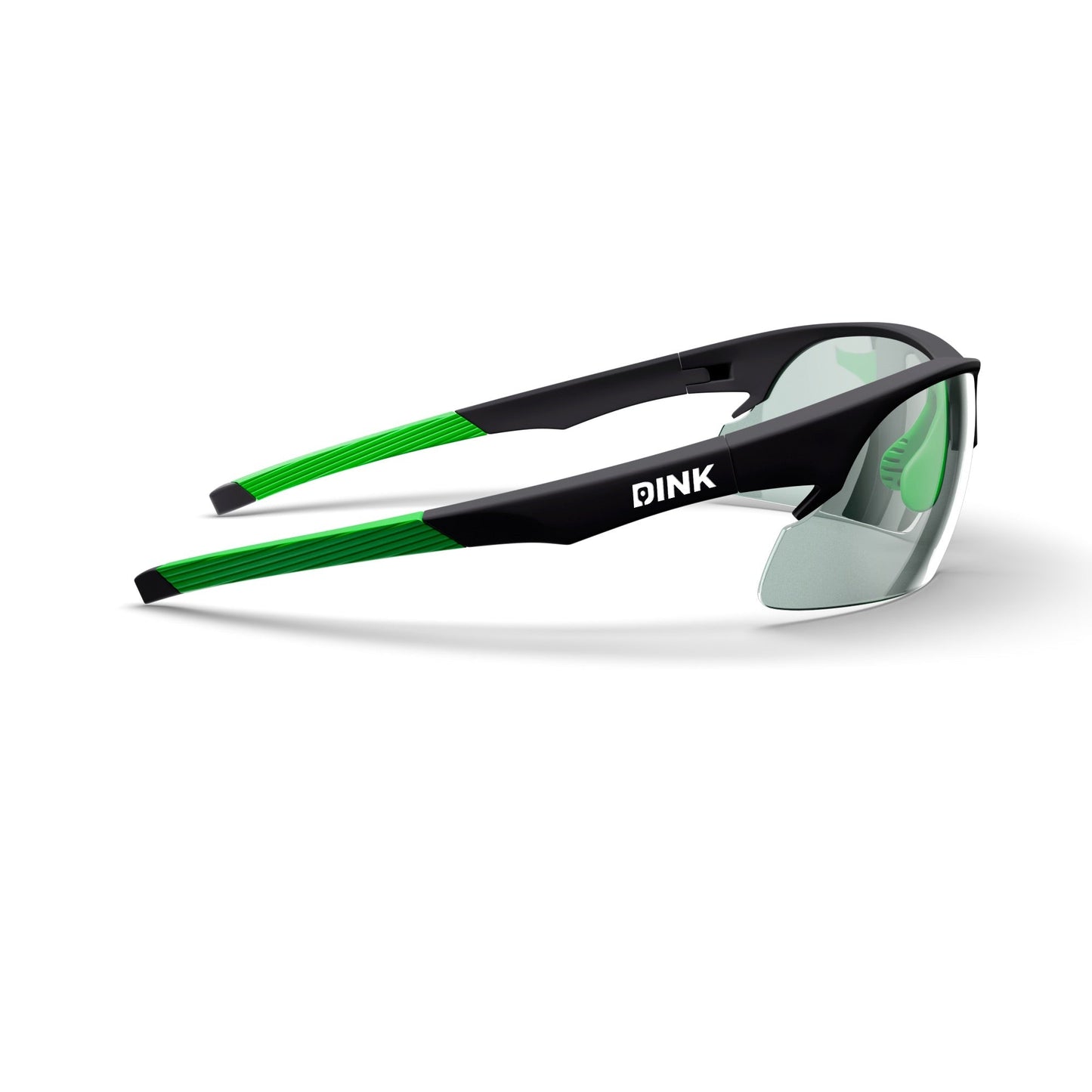 The Daytona Pickleball Sunglasses by Dink Eyewear feature a sporty black frame with green temple accents, lightweight wrap design, tinted lenses, and the DINK logo in white on the side.