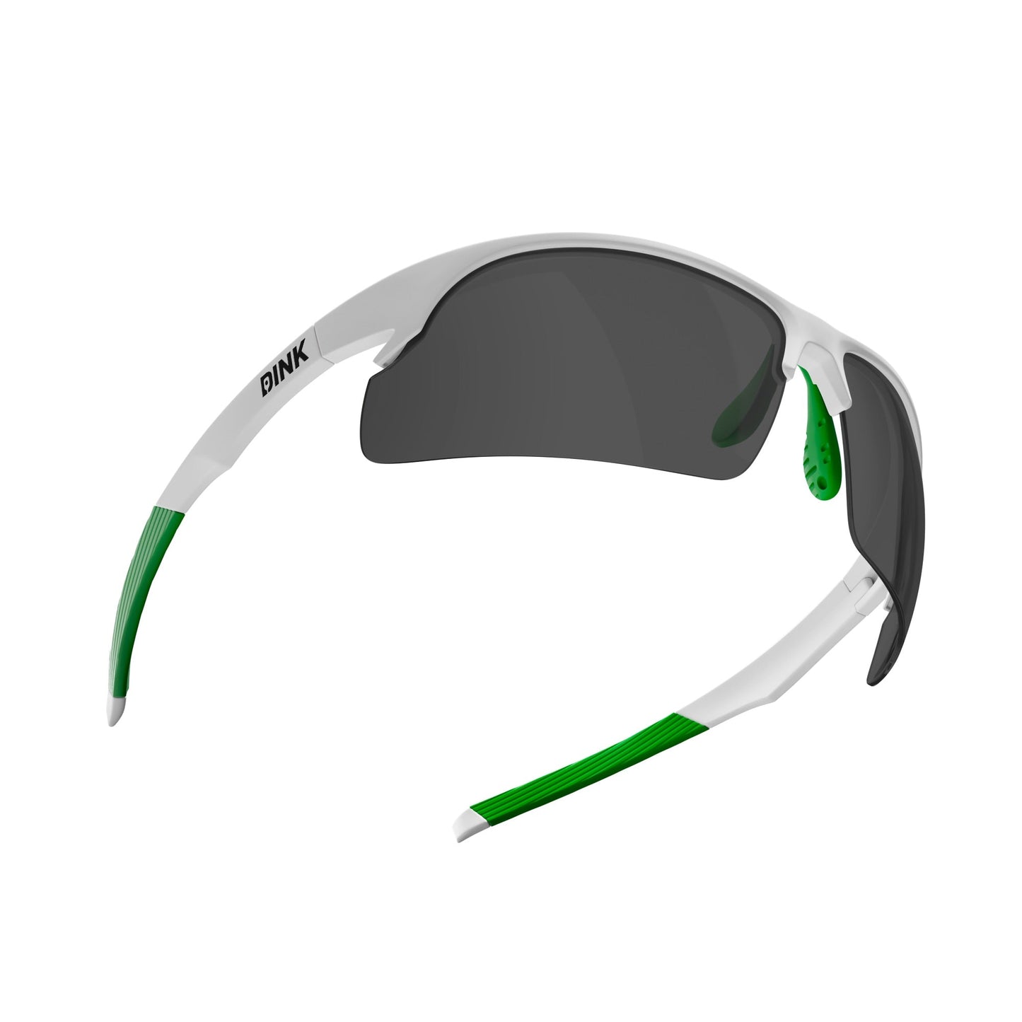 The Daytona Pickleball Sunglasses by Dink Eyewear feature a white and green frame, curved arms with green grip, large sporty dark wrap lenses, and “DINK” printed in black on the left arm—perfect for pickleball players.