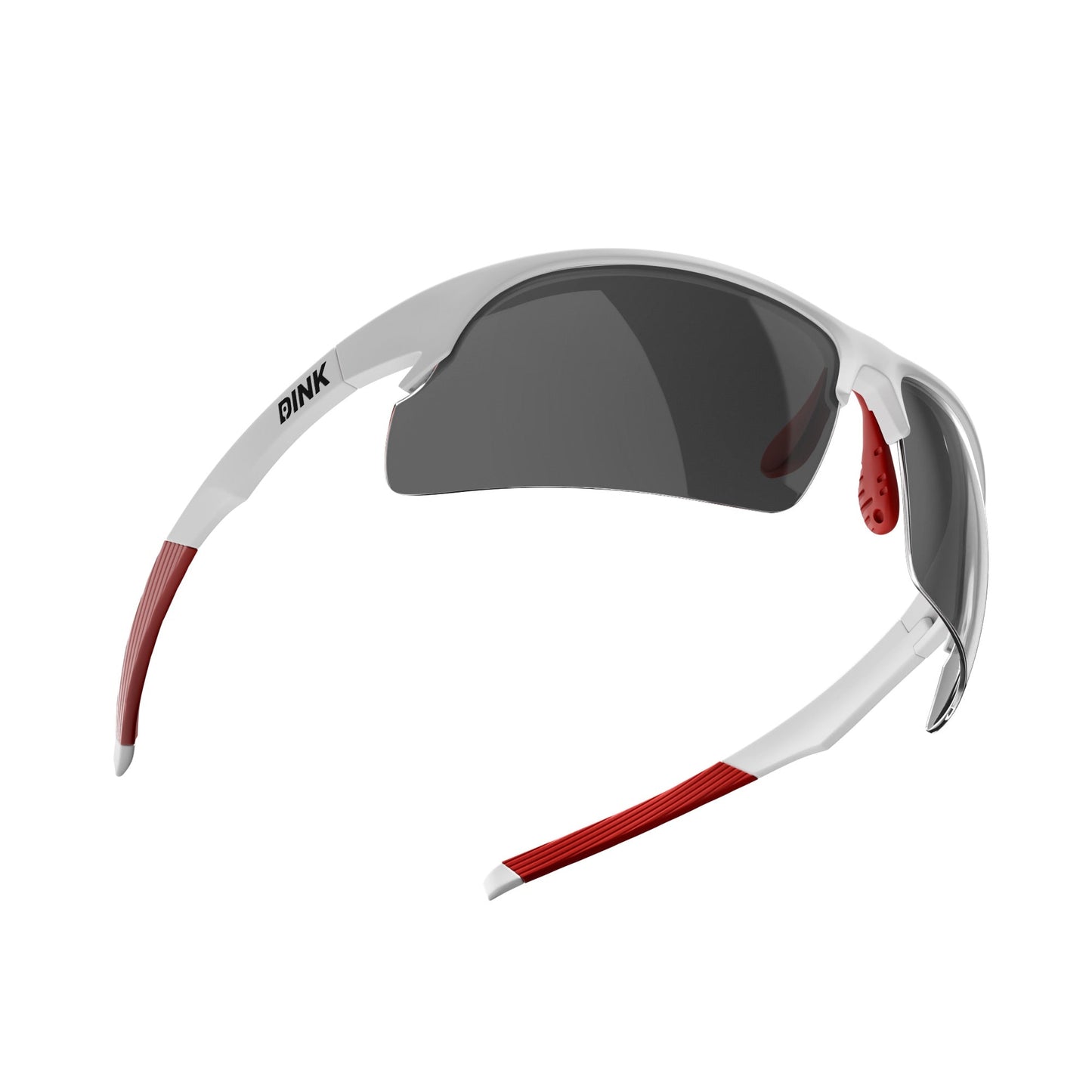 The Daytona Pickleball Sunglasses by Dink Eyewear feature a white/red semi-rimless frame, dark wraparound lenses, and red rubber grips on the arms and nose bridge for a sporty, aerodynamic look. The Dink Eyewear logo is printed on the left arm near the hinge.