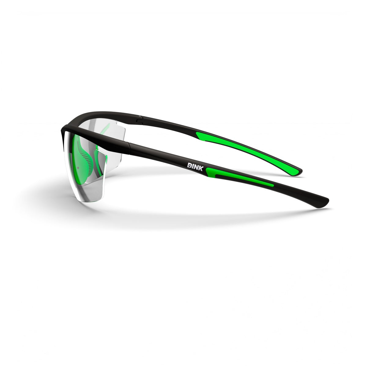 The Daytona Petite Pickleball Sunglasses by Dink Eyewear feature a sleek black wrap design, clear slightly mirrored lenses, and black arms with green accents and white branding—perfect for pickleball. Aerodynamic look on a white background.