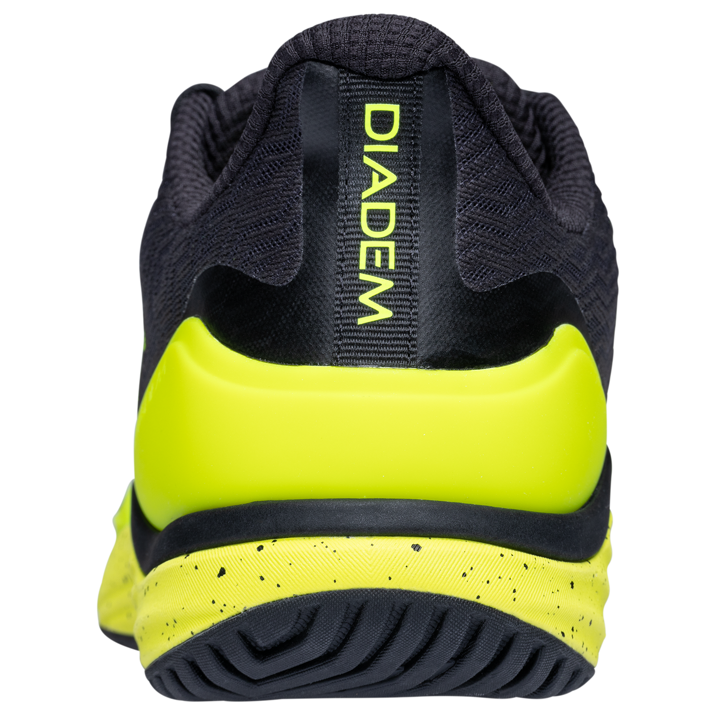 Rear view of the Diadem Court Burst by Diadem Sports: a black tennis shoe with bright yellow heel and speckled outsole, “DIADEM” in yellow on the heel tab, and a performance knit upper for a stylish, athletic look.