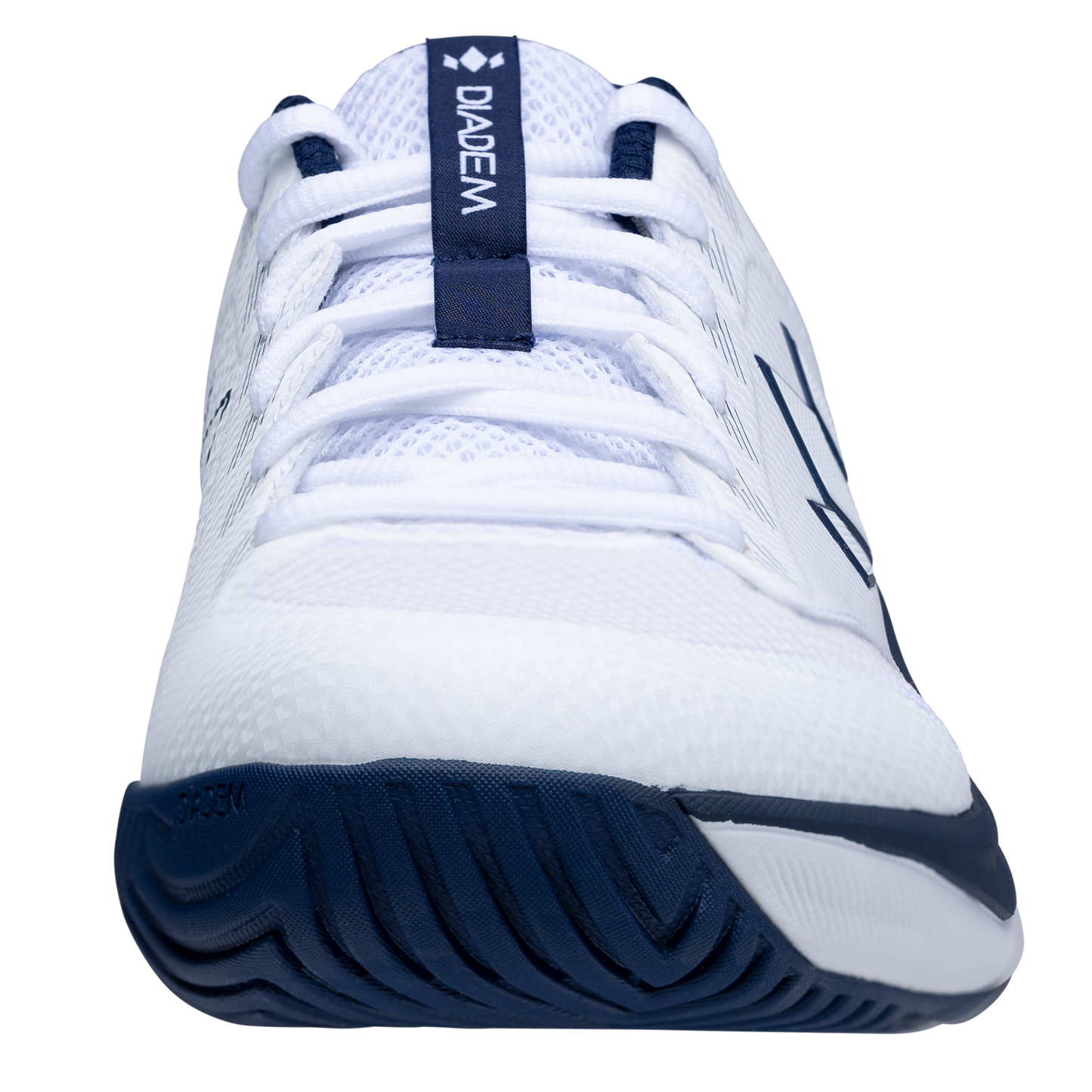 A close-up front view of the Diadem Sports Diadem Court Flo tennis shoe with navy accents. The breathable mesh upper, white laces, and patterned tread sole showcase its athletic design. "DIADEM" appears on a navy tongue strip.