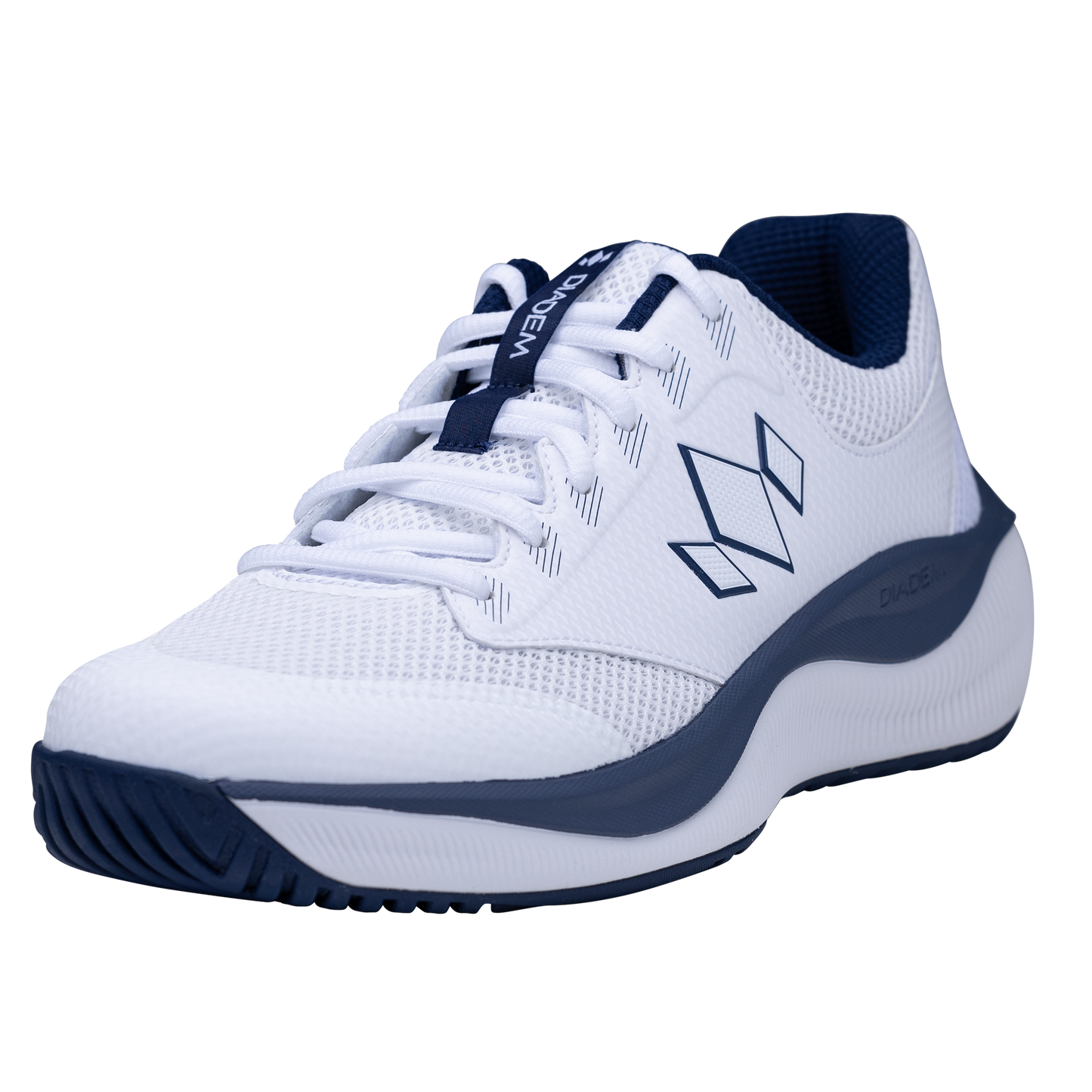 The Diadem Court Flo by Diadem Sports is a white athletic sneaker with navy accents, navy sole trim, and a geometric side logo. It features a breathable mesh upper, white laces, responsive cushioning, and textured tread for tennis play.