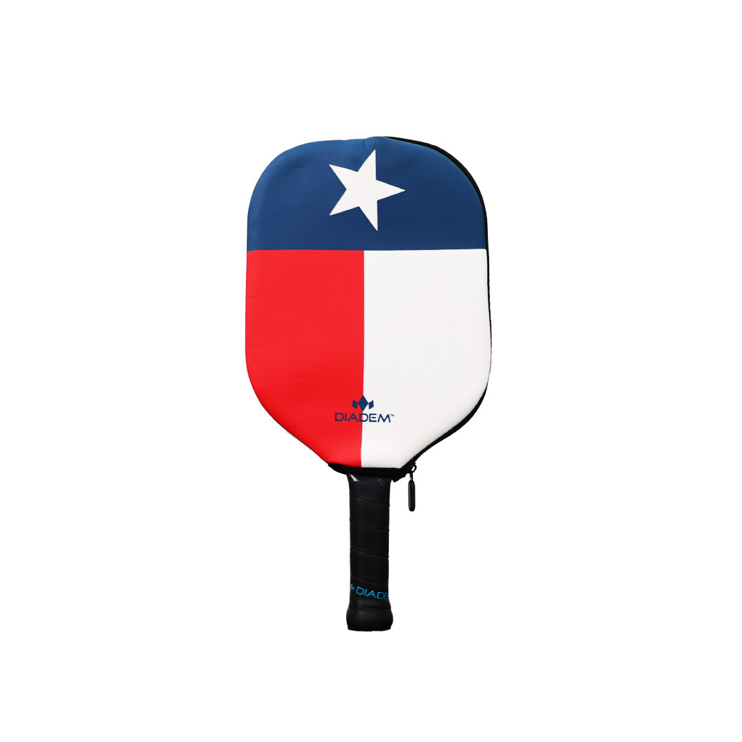The Diadem Sports Diadem Paddle Cover showcases the Texas state flag design with a blue field, white star, red and white panels, and a black handle with a blue accent. The Diadem logo is displayed near the bottom center for a stylish finish.