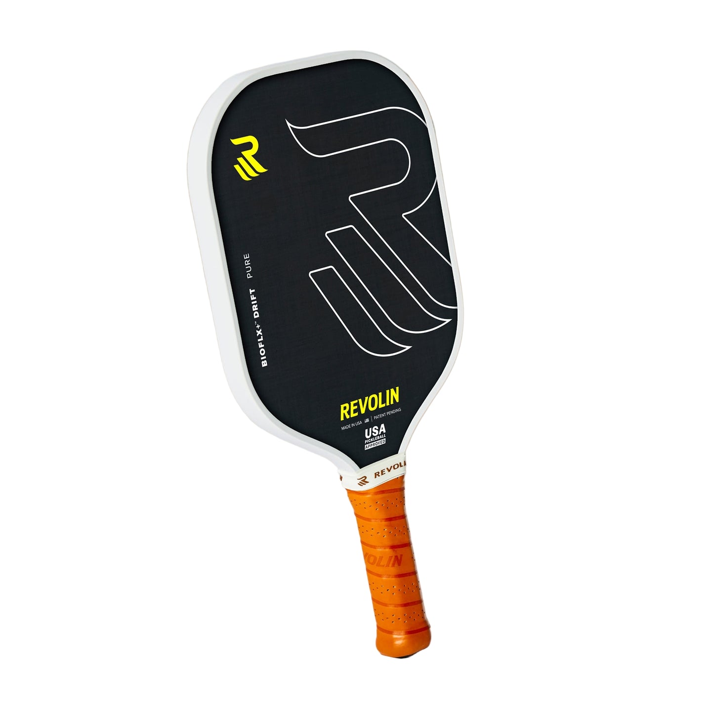 The Drift Pure Pickleball Paddle by Revolin Sports features a black and white widebody design, a bold R logo, and yellow REVOLIN USA text. Its handle, wrapped in bright orange grip tape, stands upright against a beige background with a shadow.