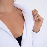 A close-up of a woman's chest wearing the Runway Athletics Court Jacket.