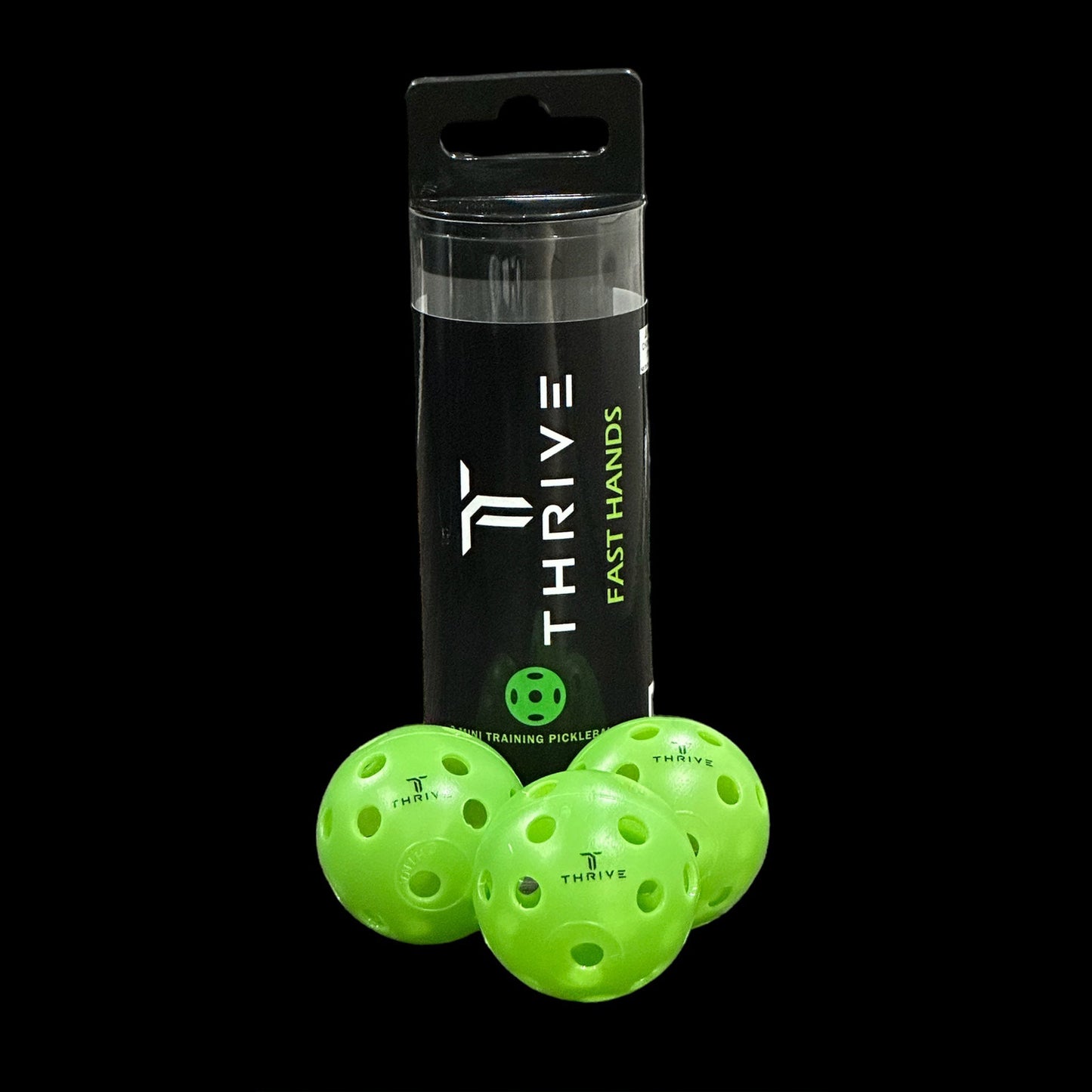 Three bright green perforated Fast Hands pickleballs by Thrive Pickleball are displayed in front of a clear cylindrical container labeled “THRIVE FAST HANDS.” The Thrive logo appears on all balls and packaging against a solid black background.