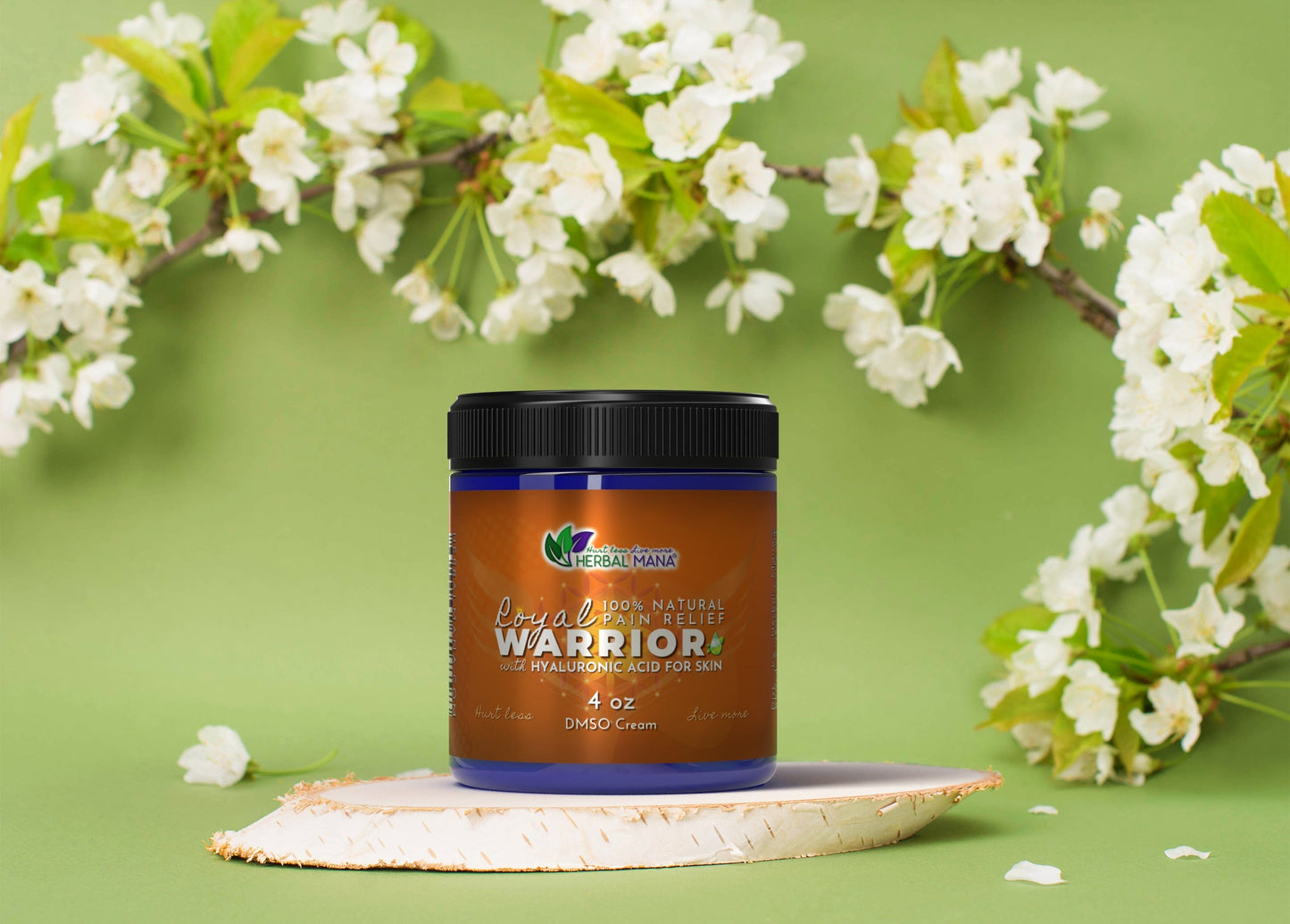 An amber jar of “Frankincense DMSO Cream for Joint Pain | Royal Warrior” by Herbal Mana sits on a round wood slice against a green background with white flowering branches, highlighting natural pain relief and hyaluronic acid.