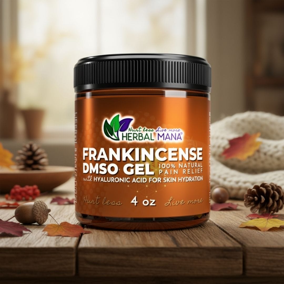 A jar of Herbal Mana Frankincense DMSO Gel with Hyaluronic Acid sits on a wooden surface among autumn leaves, pine cones, and acorns, its label highlighting natural pain relief and skin hydration. A cozy room is softly blurred in the background.