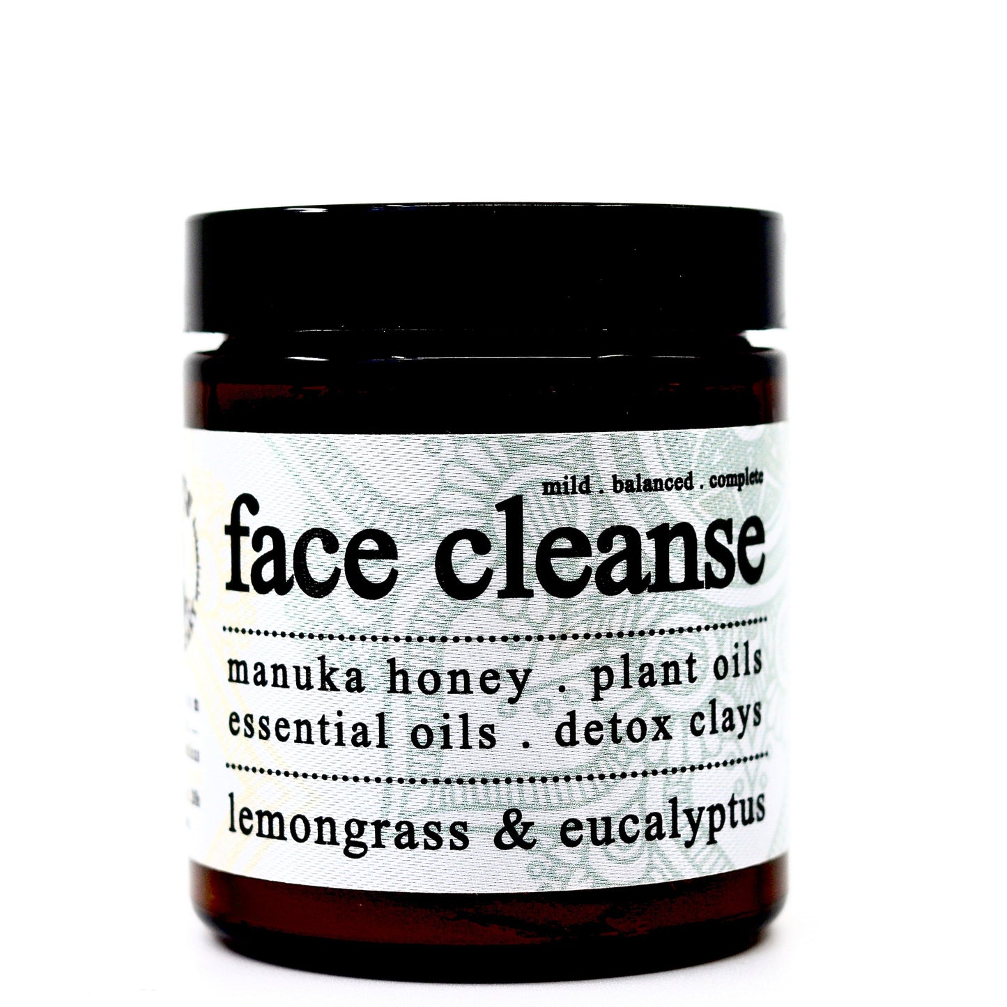 A brown Roots Apothecary face cleanse jar highlights manuka honey, detox clays, plant oils, and Dead Sea salt with lemongrass and eucalyptus scents. The label describes this cold process soap as mild, balanced, and complete.