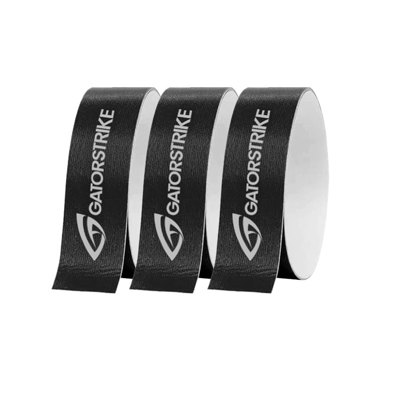 Three rolls of GATORSTRIKE™ Edge Guard Tape - 3 Pack stand upright, each showing the GATORSTRIKE logo and name with a stylized G, perfect for paddle edge protection. The products are set against a plain white background.