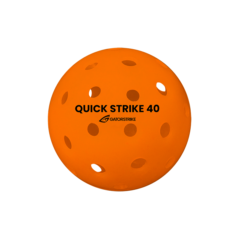 A vibrant orange GATORSTRIKE™ Quick Strike Pickleball, featuring multiple evenly spaced holes and black text on the front, is designed for high-performance outdoor play and displayed against a plain white background.