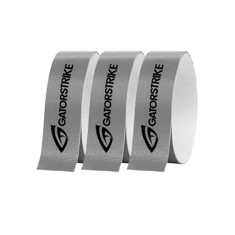 Three rolls of GATORSTRIKE™ Edge Guard Tape (3 Pack) from GATORSTRIKE are side by side, each showing the black logo and name. The gray tapes are slightly unspooled for paddle edge protection against a plain white background.