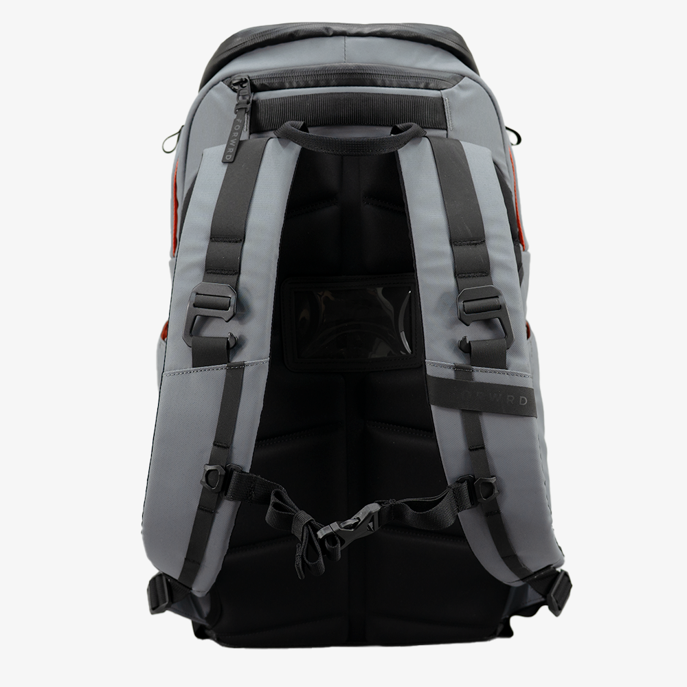 The FORWRD Court Caddy Pickleball Bag is shown from the back, featuring gray and black premium materials, padded shoulder straps with black adjustable buckles, a chest strap, and a central see-through pocket against a plain white background.