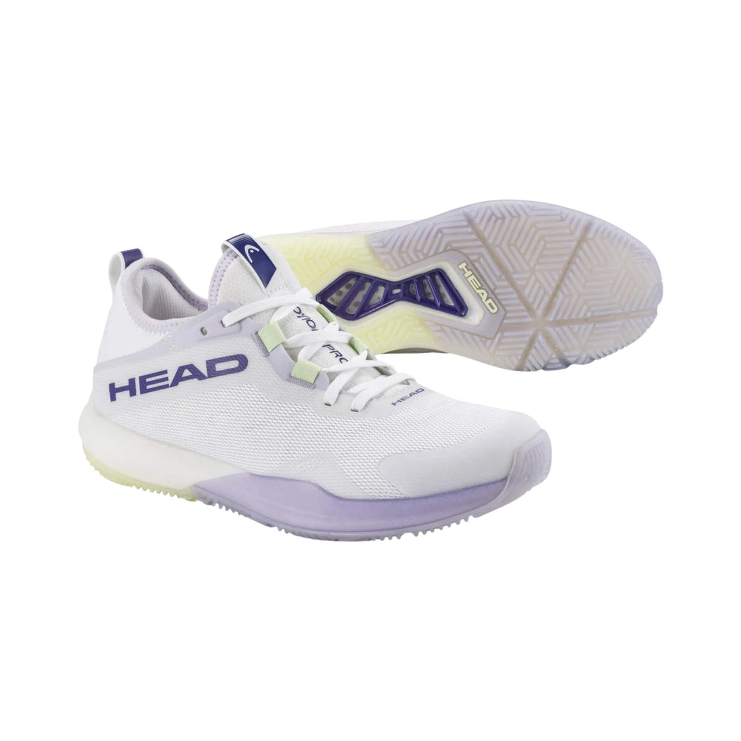 A pair of Head Motion Pro Padel Women's Shoes WHLA by Padel USA in white with purple and light yellow accents. One shoe is upright, the other shows the sole’s grip-friendly textured rubber; mesh uppers and HEAD branding are visible.