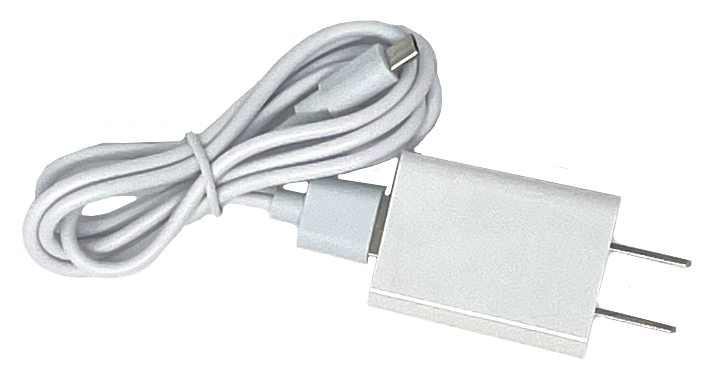 The iReliev Relaxable™ Eye Massager with Heat comes with a white USB wall charger and a matching USB-C cable, neatly coiled and secured, ideal for powering your device—shown against a plain background.